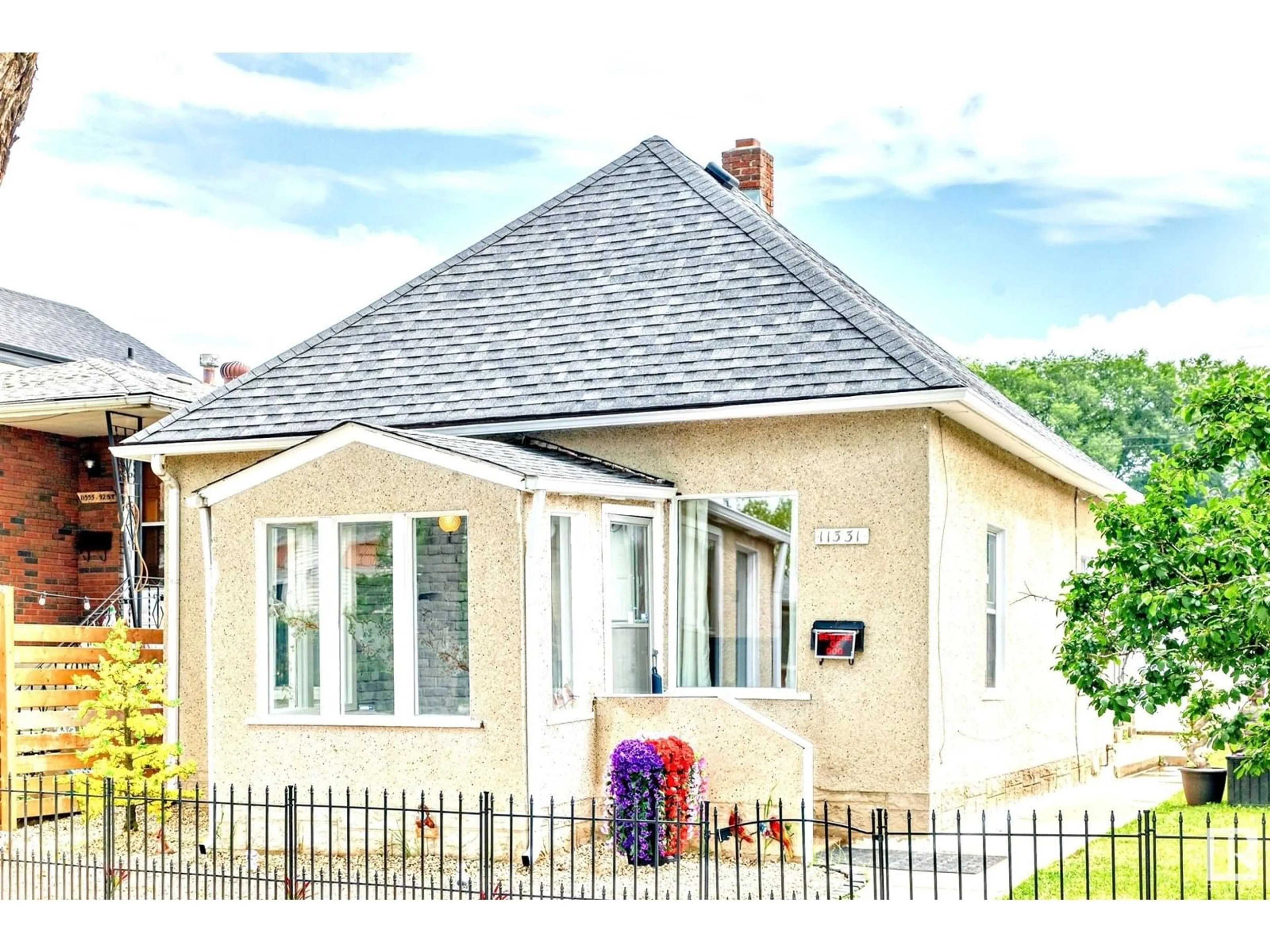Home with brick exterior material, street for 11331 92 ST, Edmonton Alberta T5G0Z4