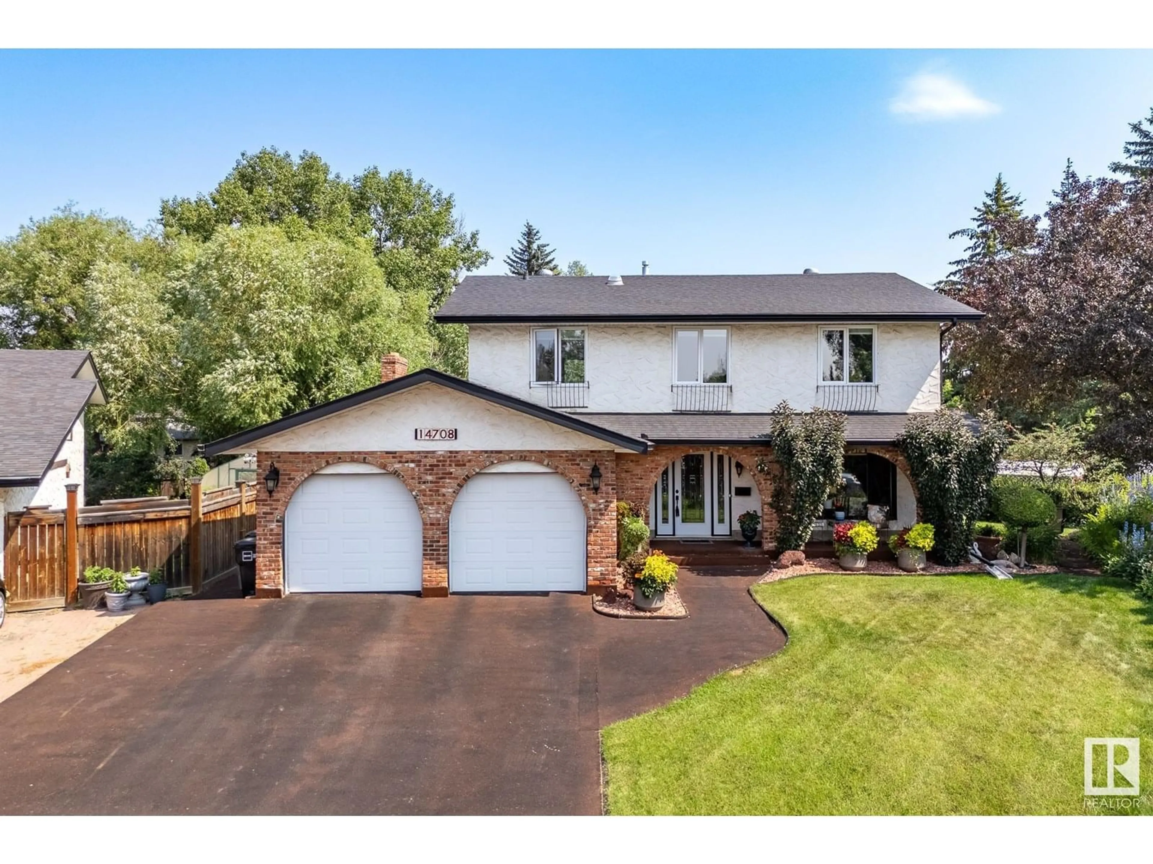 Home with vinyl exterior material, street for 14708 58 AV, Edmonton Alberta T6H4T2