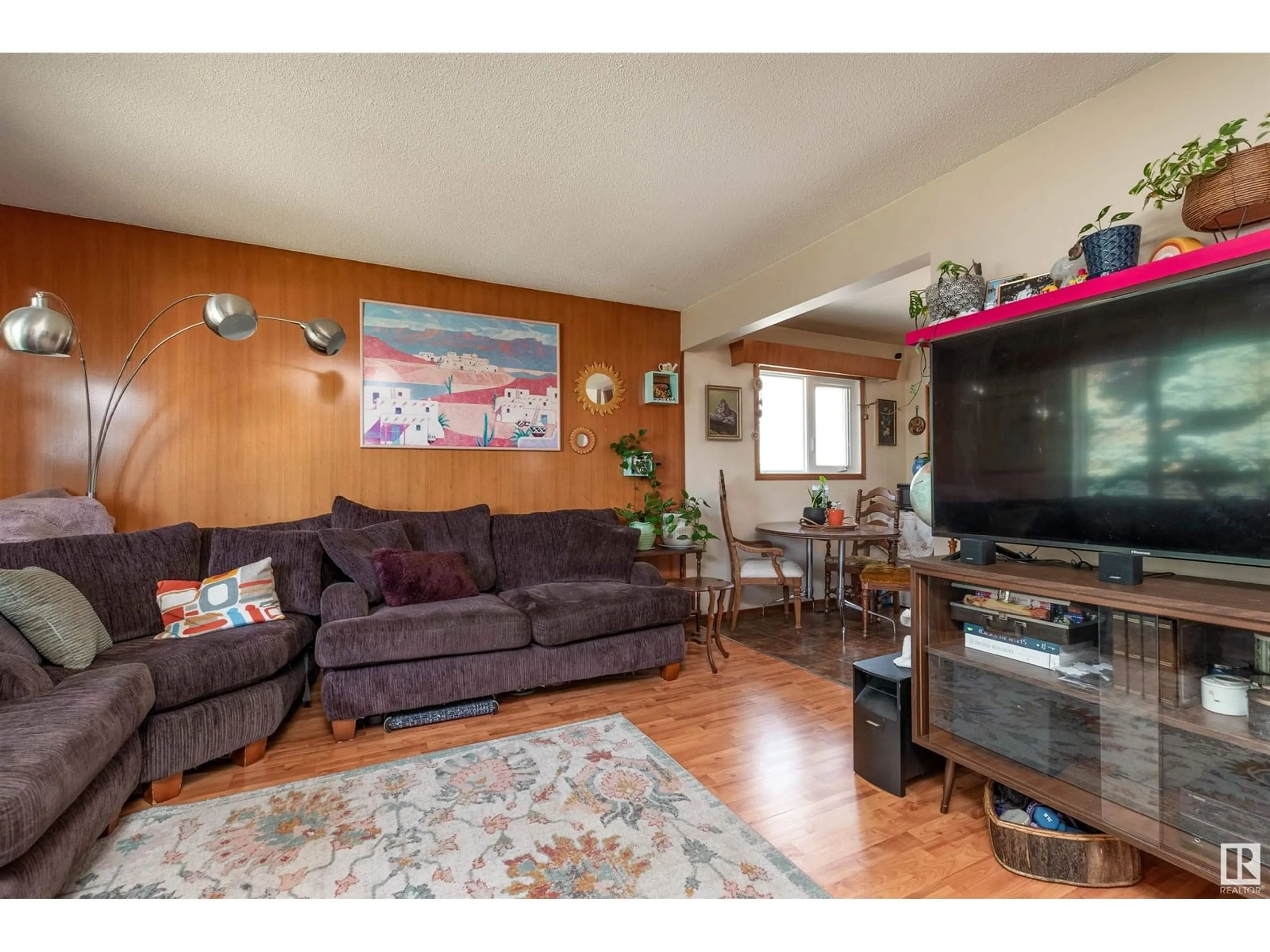 Living room with furniture, wood/laminate floor for NW - 12735 129 ST, Edmonton Alberta T5L1H9