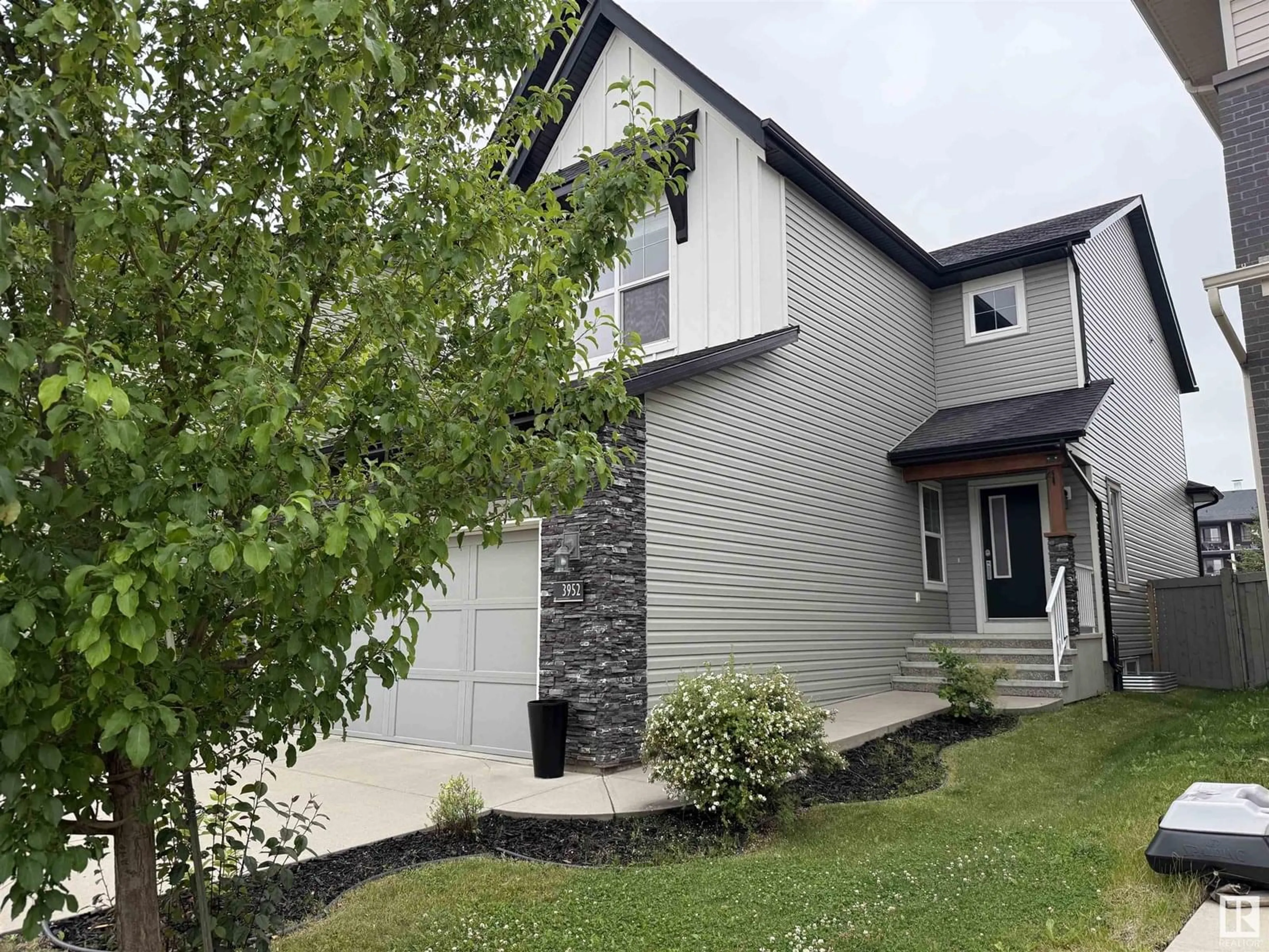 Home with vinyl exterior material, street for SW - 3952 CLAXTON LO, Edmonton Alberta T6W1Y7
