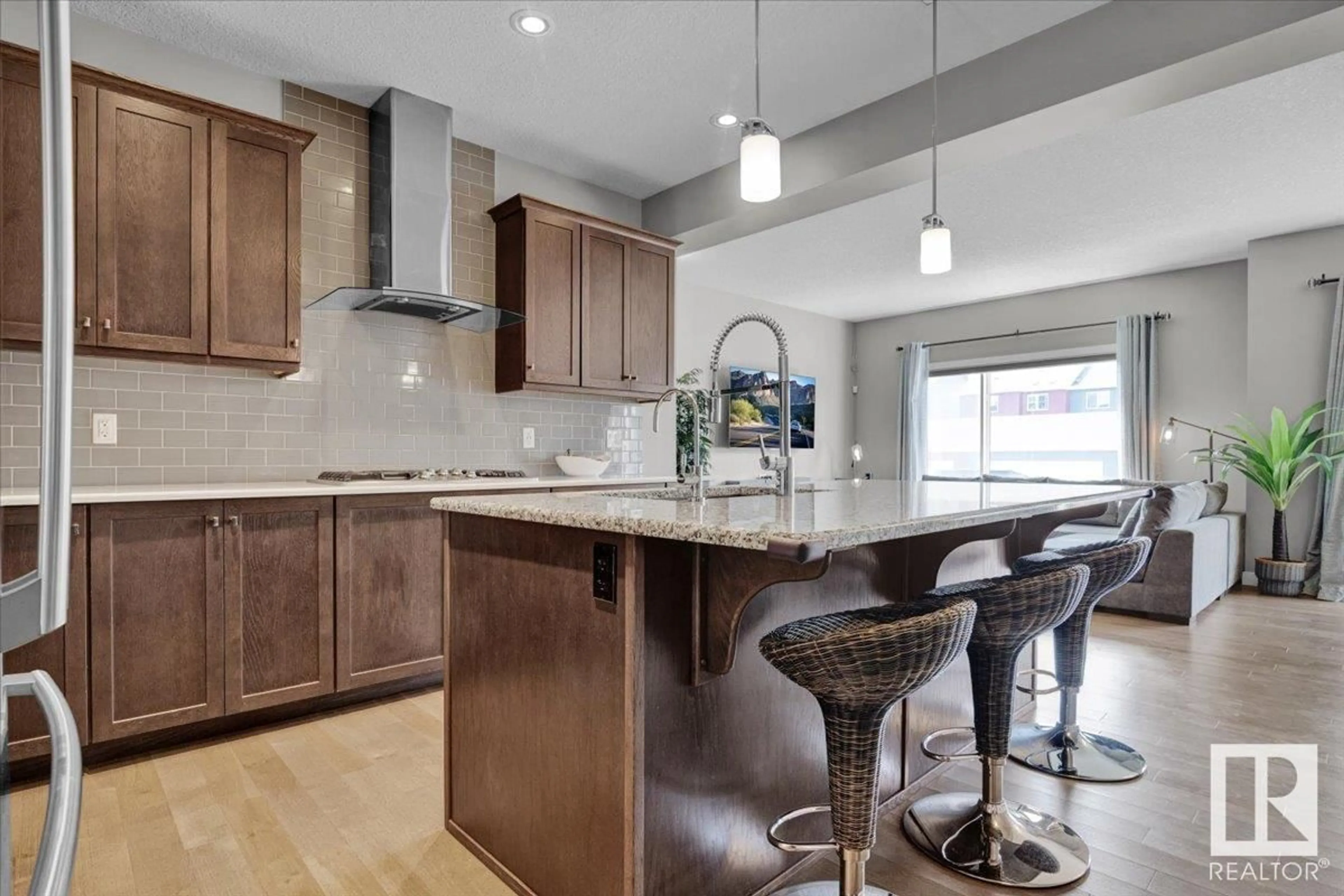 Open concept kitchen, wood/laminate floor for 167 STURTZ BN, Leduc Alberta T9E1E3