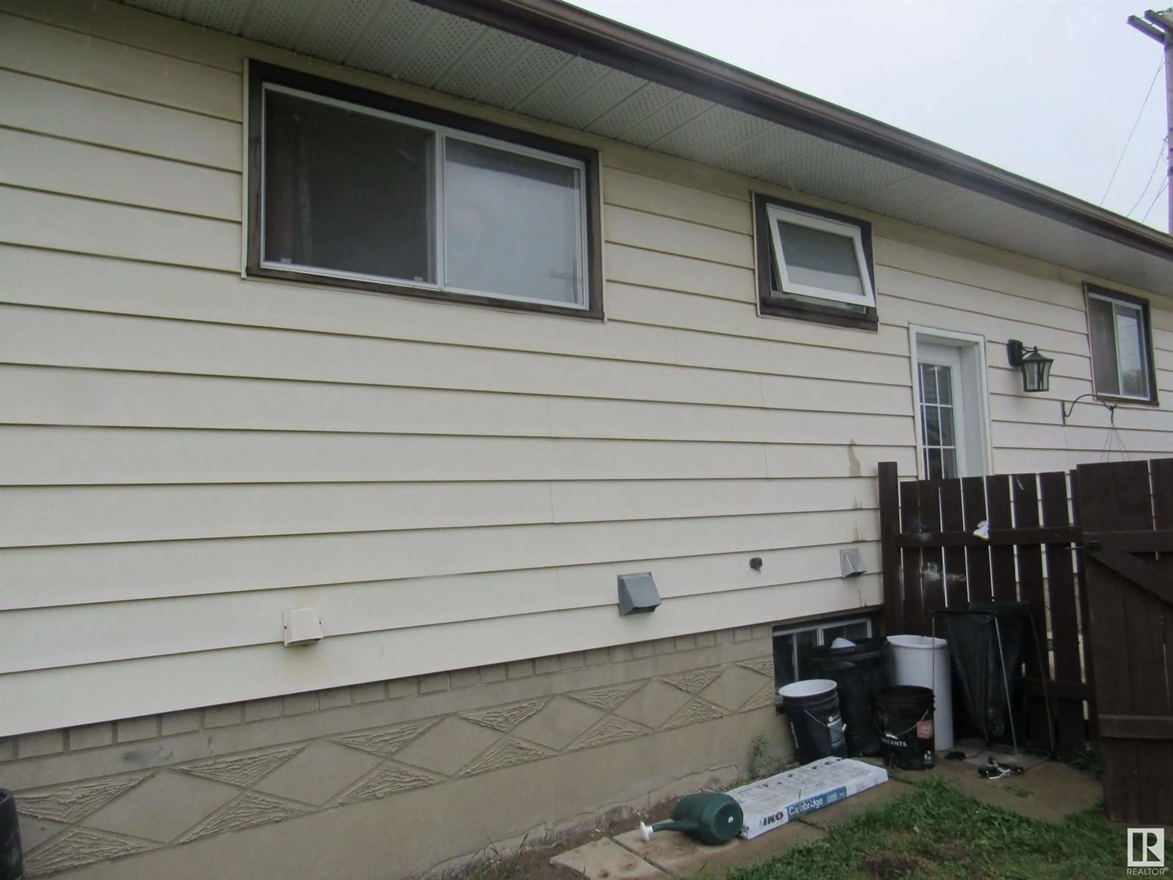 Home with vinyl exterior material, street for 4611 53 AVE, Barrhead Alberta T7N1H3