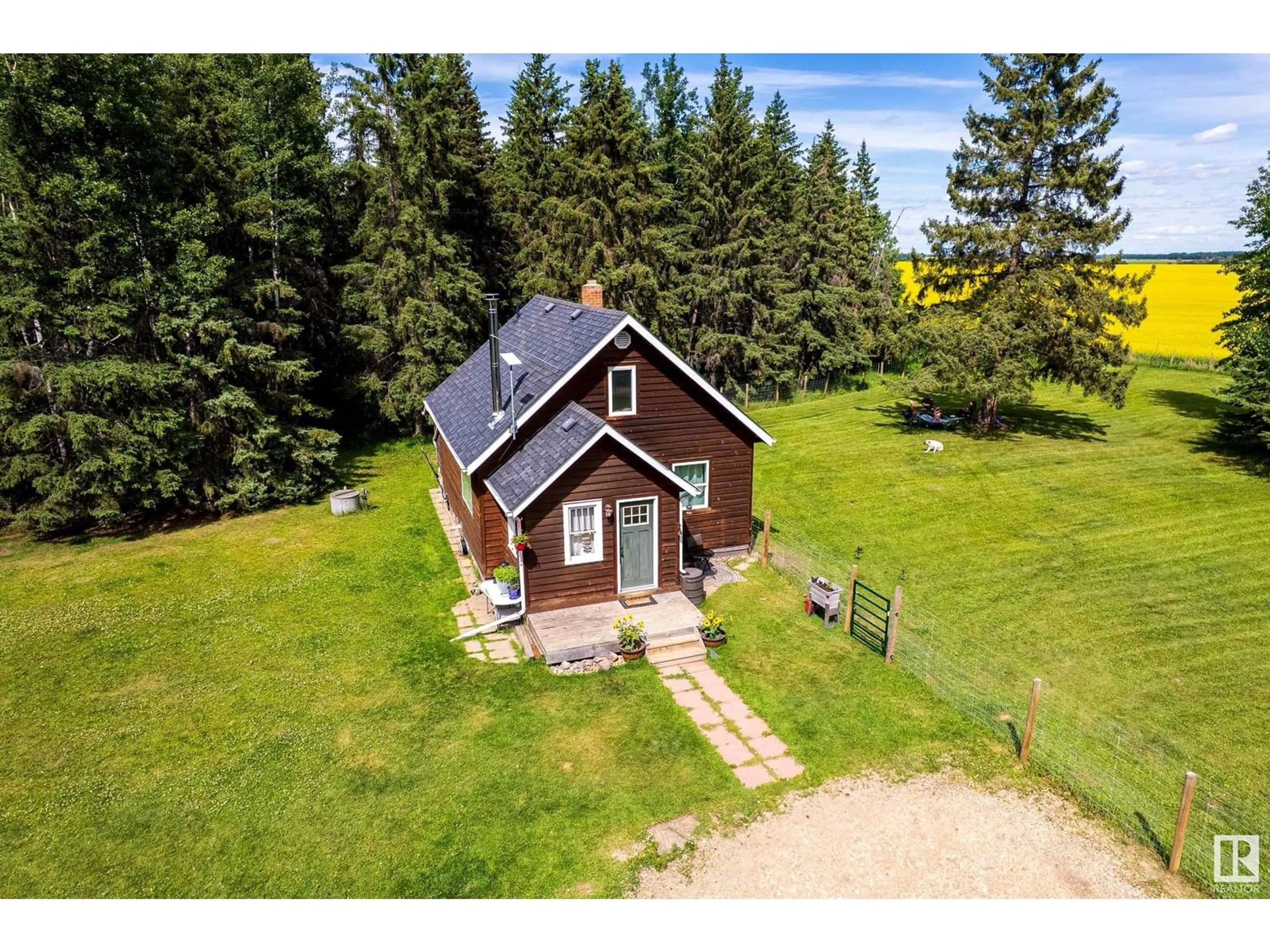 A pic from outside/outdoor area/front of a property/back of a property/a pic from drone, building for 1526 TWP RD 603, Rural Westlock County Alberta T7P2P4