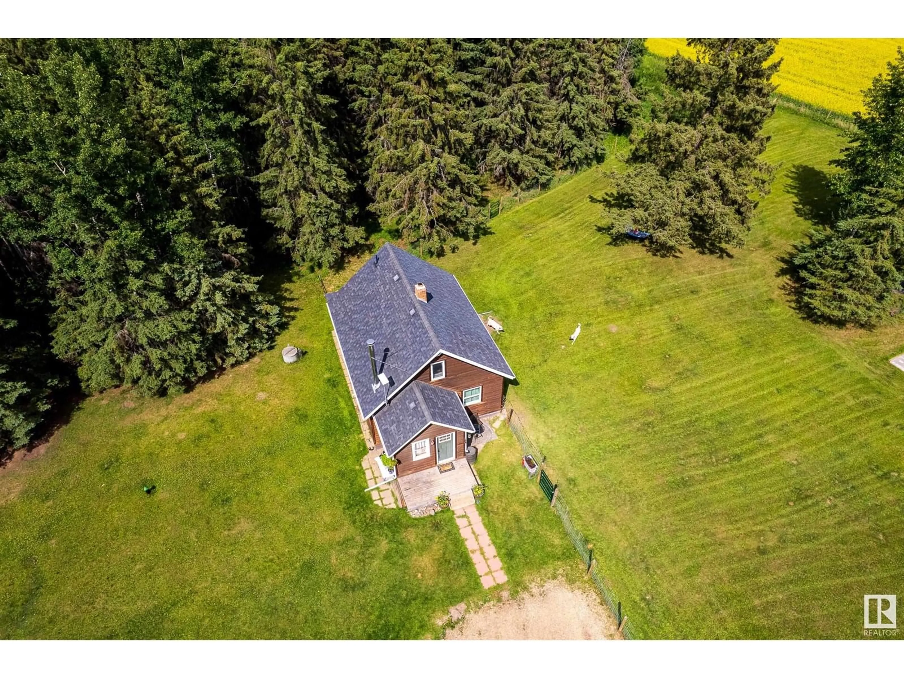A pic from outside/outdoor area/front of a property/back of a property/a pic from drone, unknown for 1526 TWP RD 603, Rural Westlock County Alberta T7P2P4