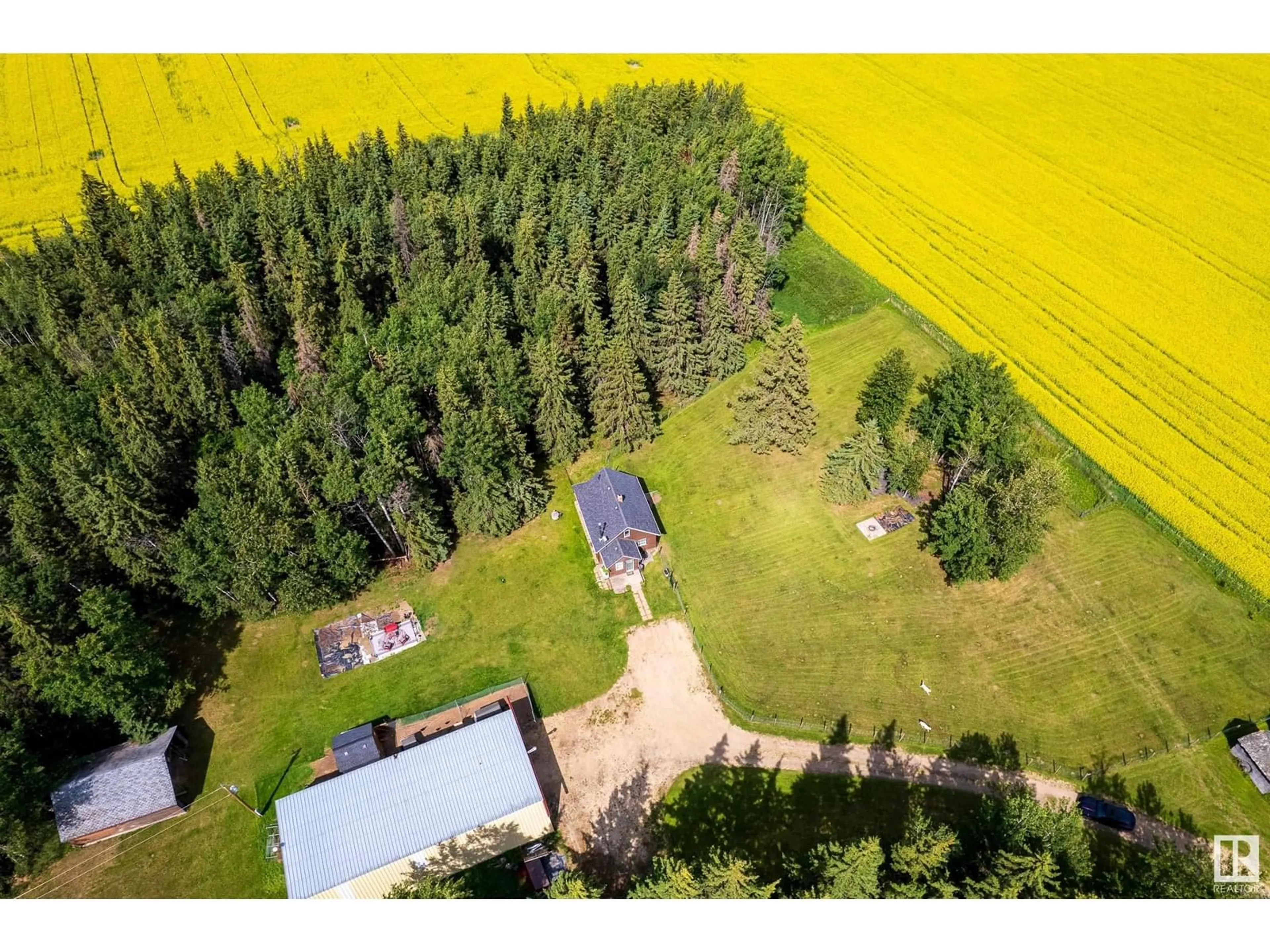 A pic from outside/outdoor area/front of a property/back of a property/a pic from drone, forest/trees view for 1526 TWP RD 603, Rural Westlock County Alberta T7P2P4