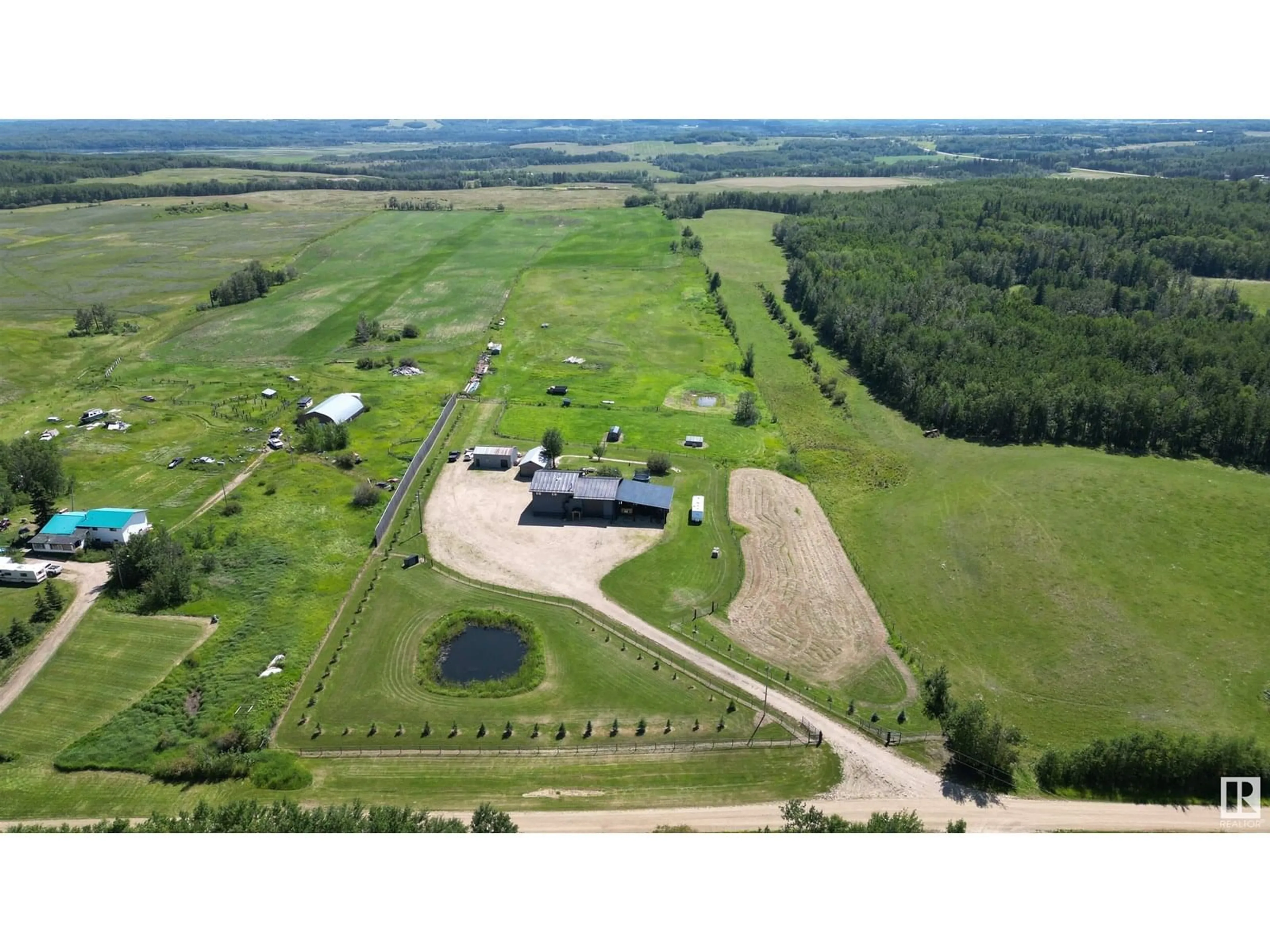 A pic from outside/outdoor area/front of a property/back of a property/a pic from drone, building for 6415 TWP ROAD 540, Rural Parkland County Alberta T0E0S0