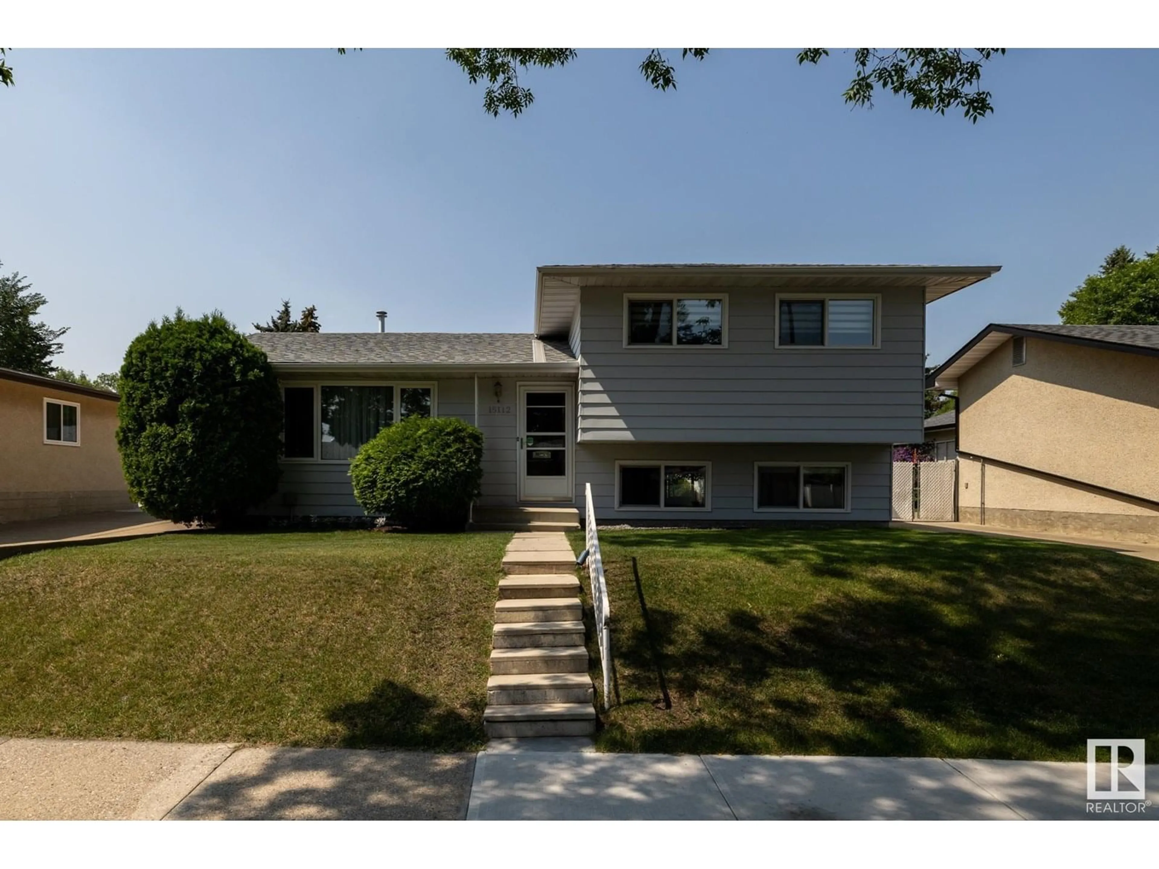 Home with vinyl exterior material, street for NW - 15112 64 ST, Edmonton Alberta T5A2C5