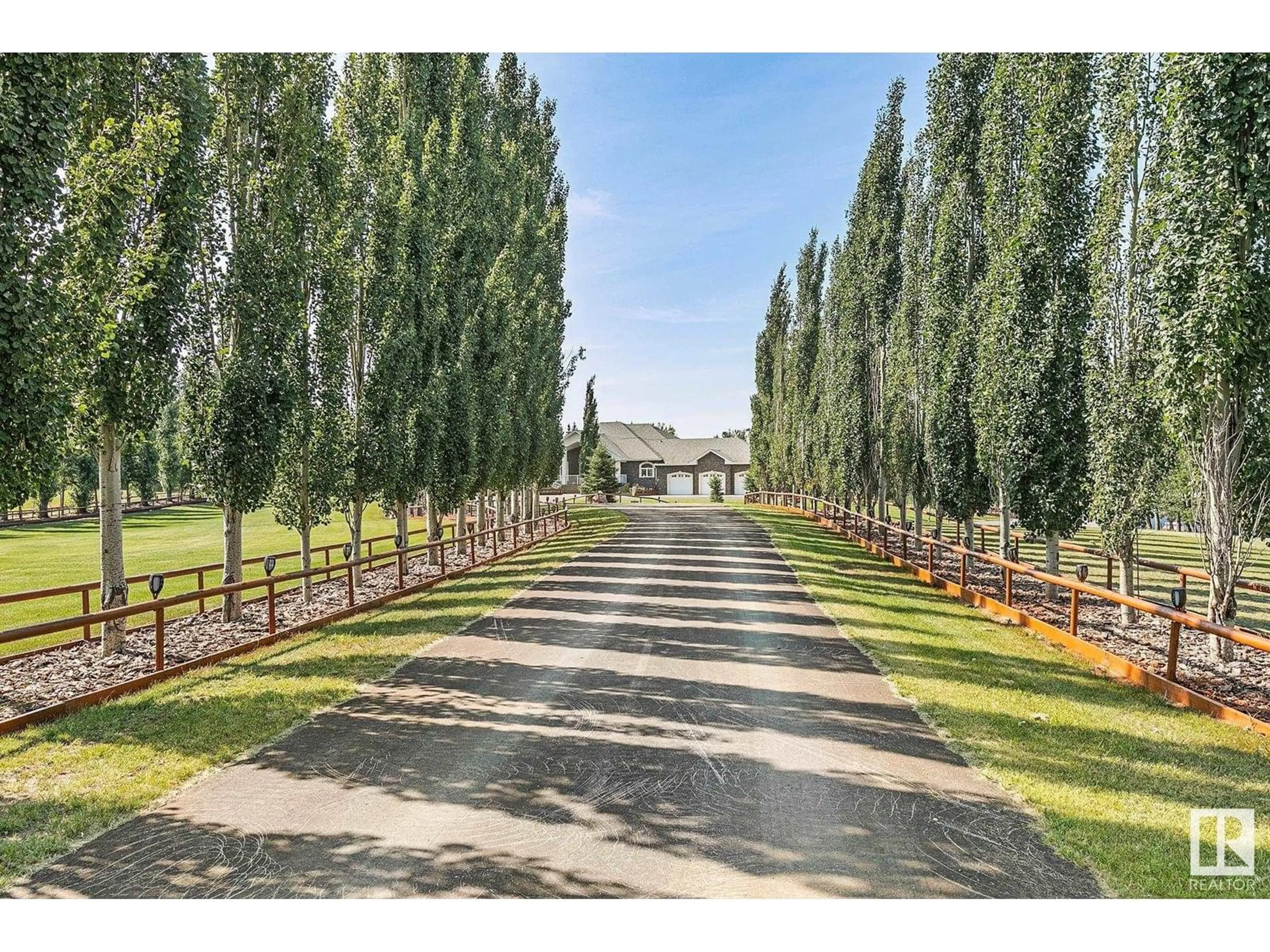 A pic from outside/outdoor area/front of a property/back of a property/a pic from drone, street for 400 - 51430 RGE ROAD 231, Rural Strathcona County Alberta T8B1K9