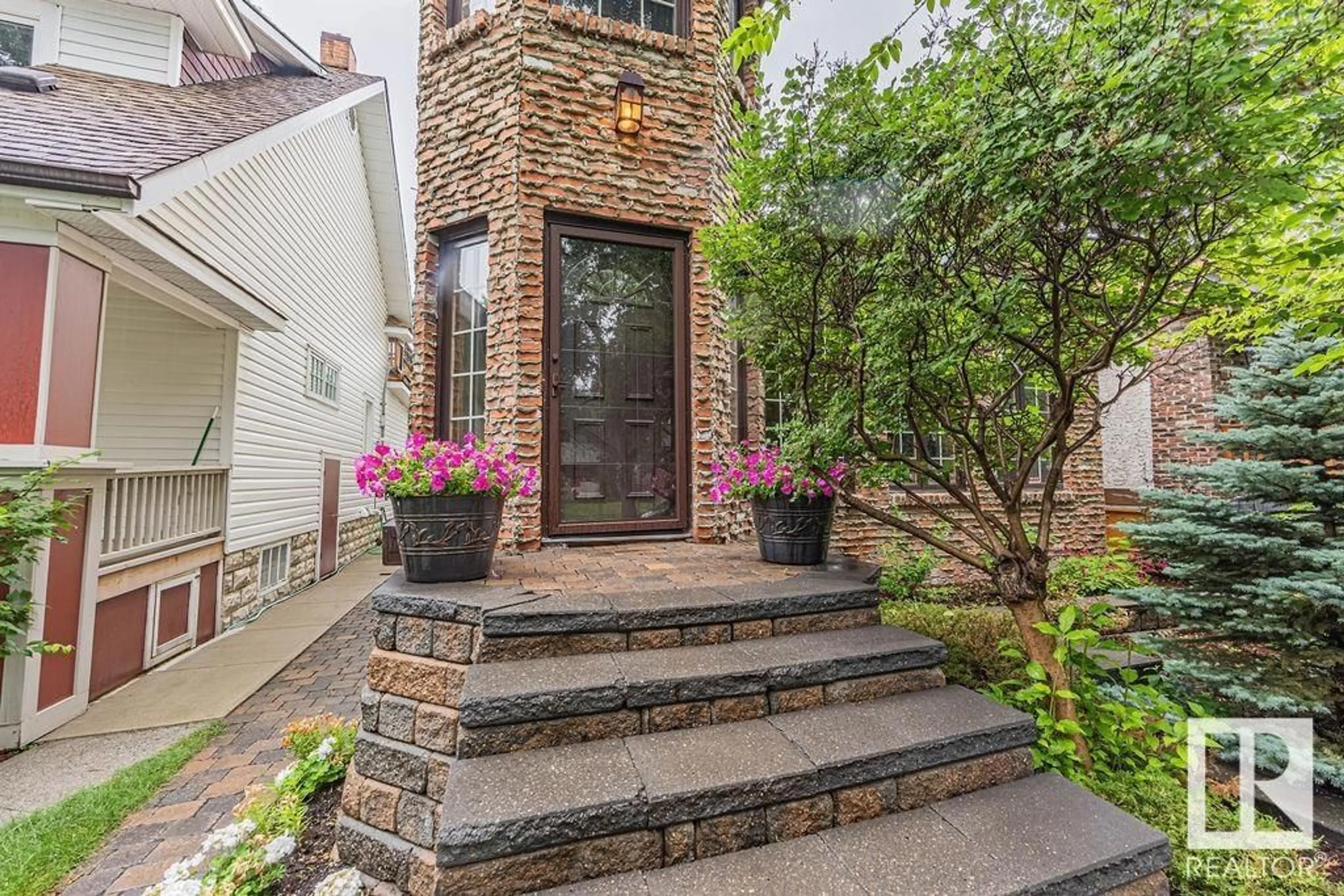 Home with brick exterior material, street for 11132 65 ST, Edmonton Alberta T5W4K1