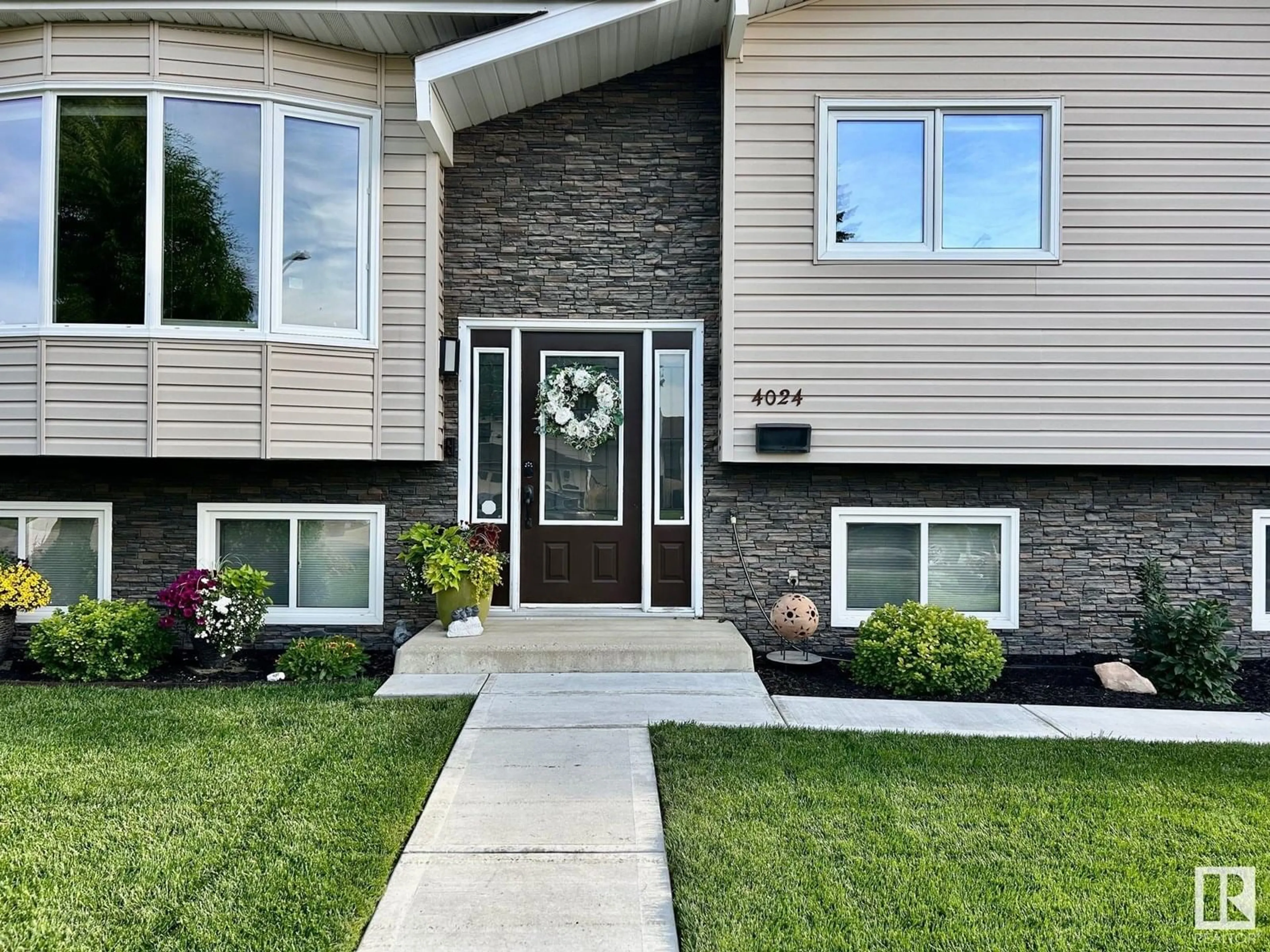 Home with vinyl exterior material, street for 4024 19 AV, Edmonton Alberta T6L3M7