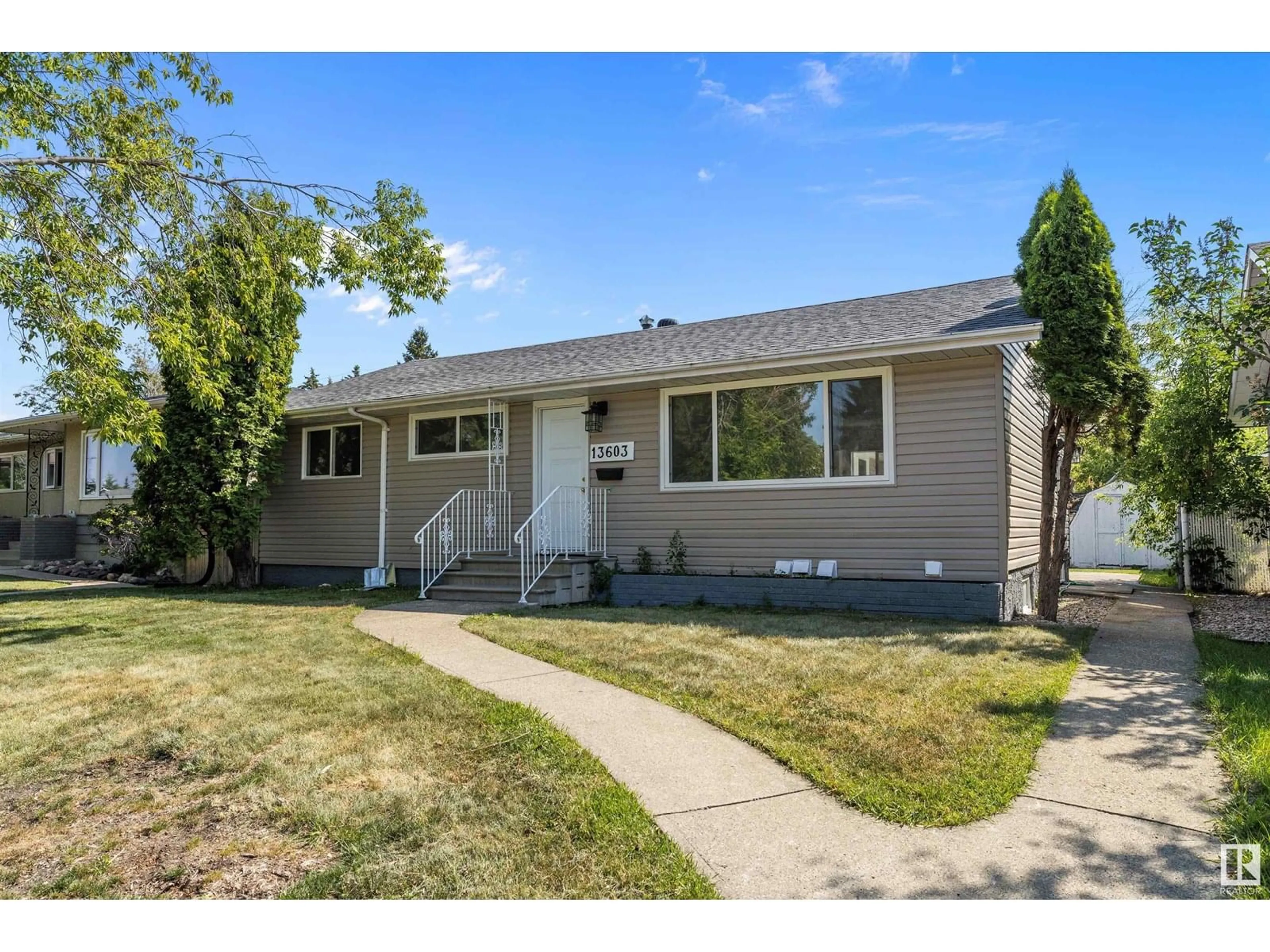 Home with vinyl exterior material, street for 13603 137 ST, Edmonton Alberta T5L2B2