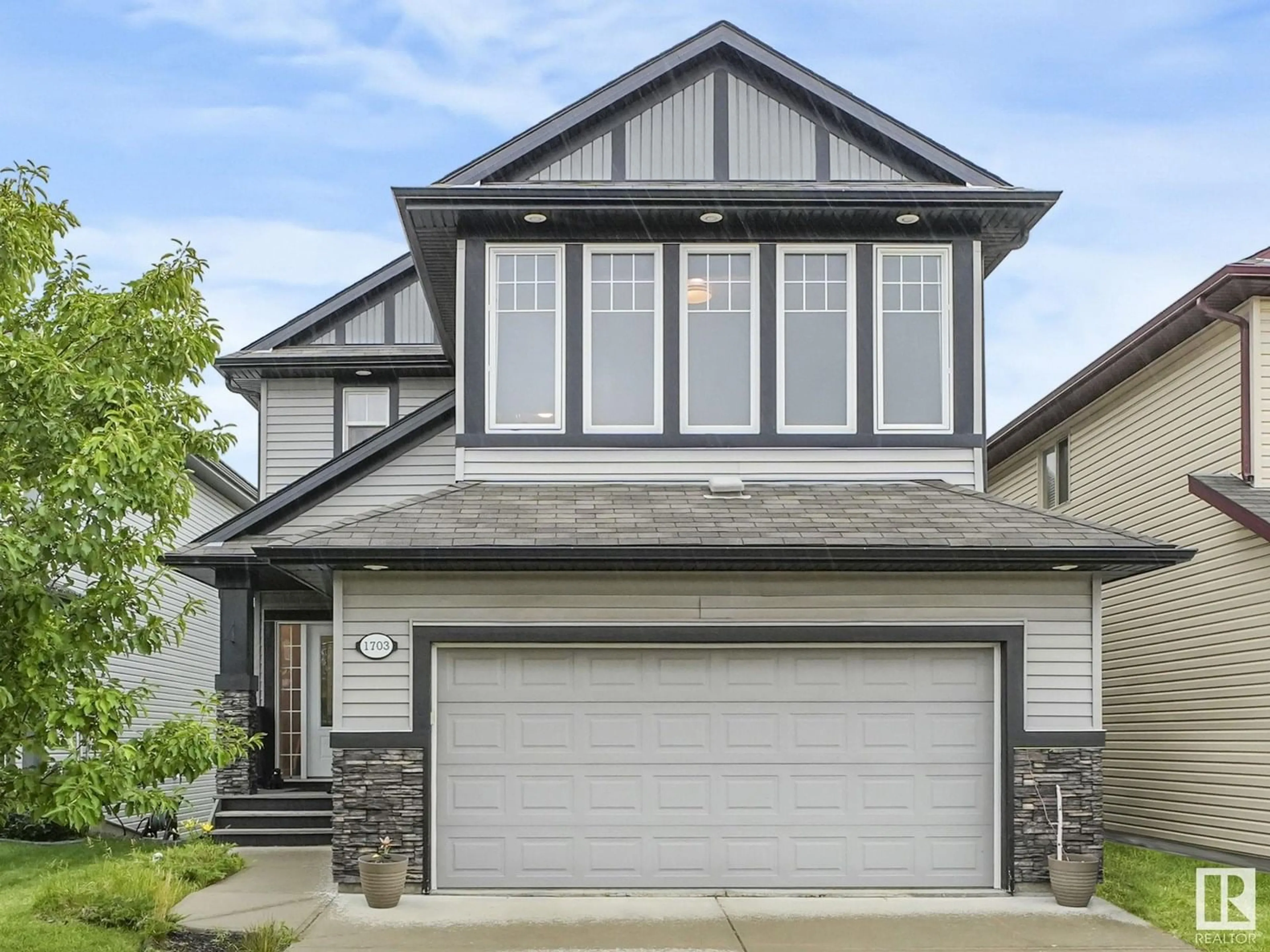 Home with vinyl exterior material, street for NW - 1703 33B ST, Edmonton Alberta T6T0P2
