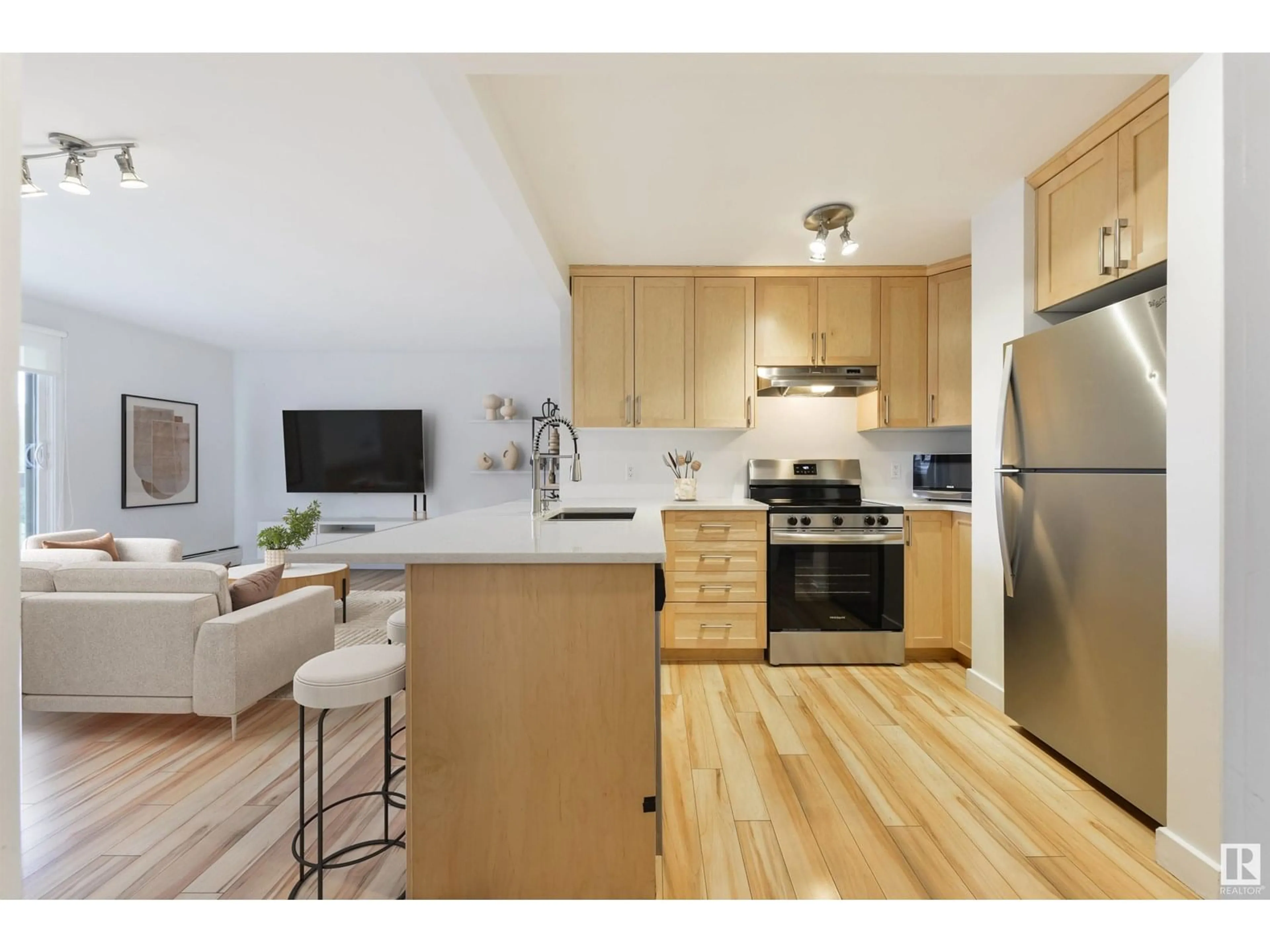 Open concept kitchen, wood/laminate floor for 9715 - 607 110 ST, Edmonton Alberta T5K2M1
