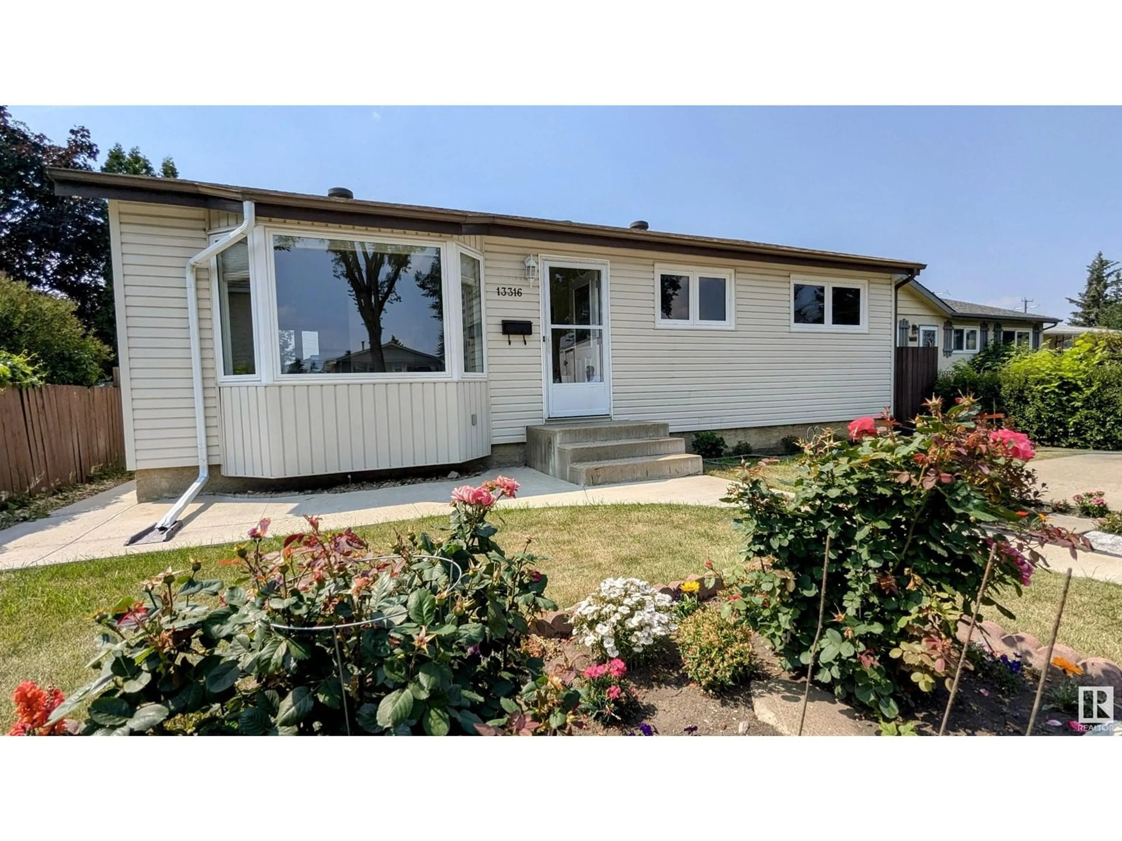 Home with vinyl exterior material, street for 13316 116 ST, Edmonton Alberta T5E5H7