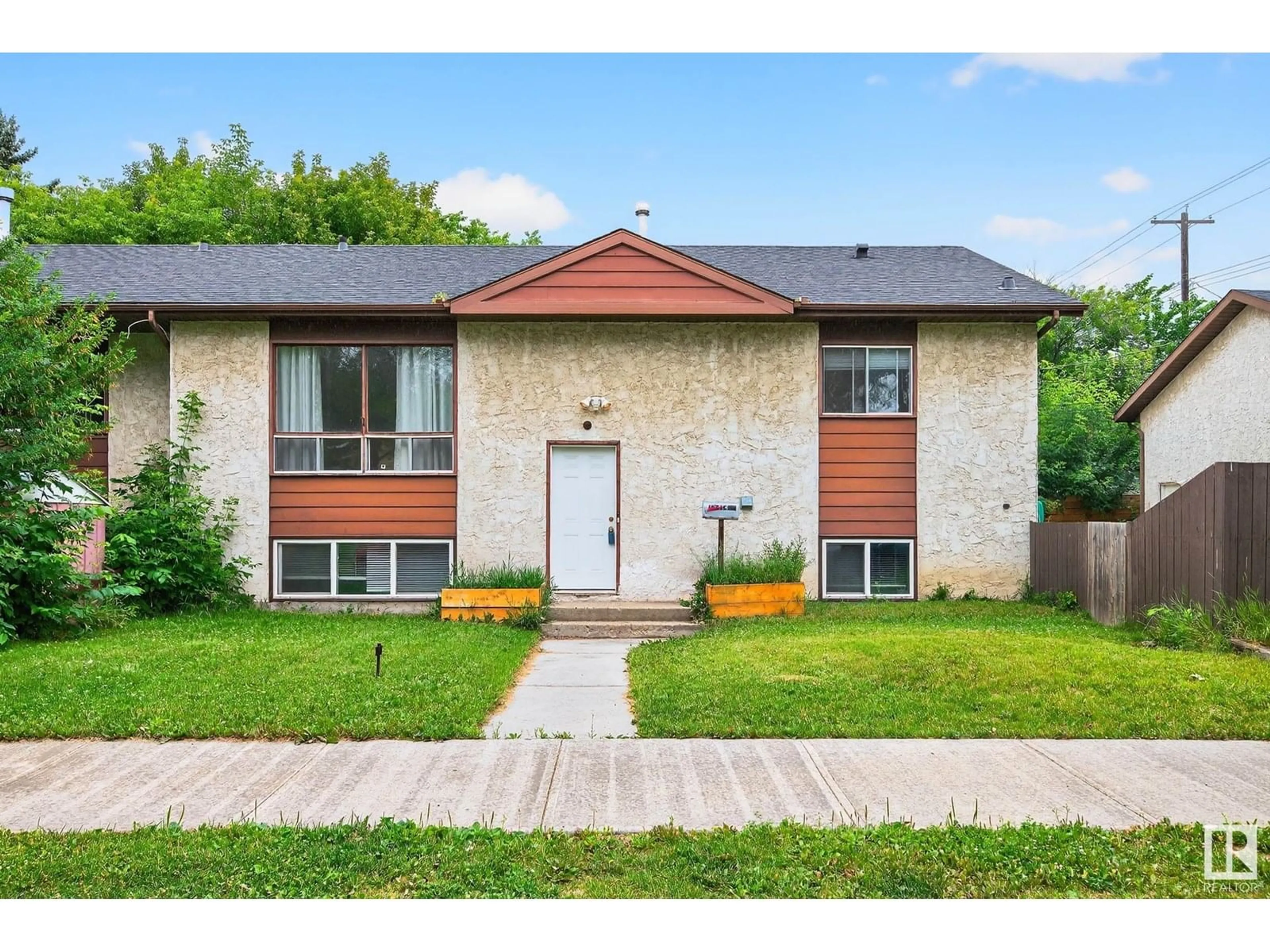 Home with brick exterior material, street for NW - 12414 112 AV, Edmonton Alberta T5M2S9