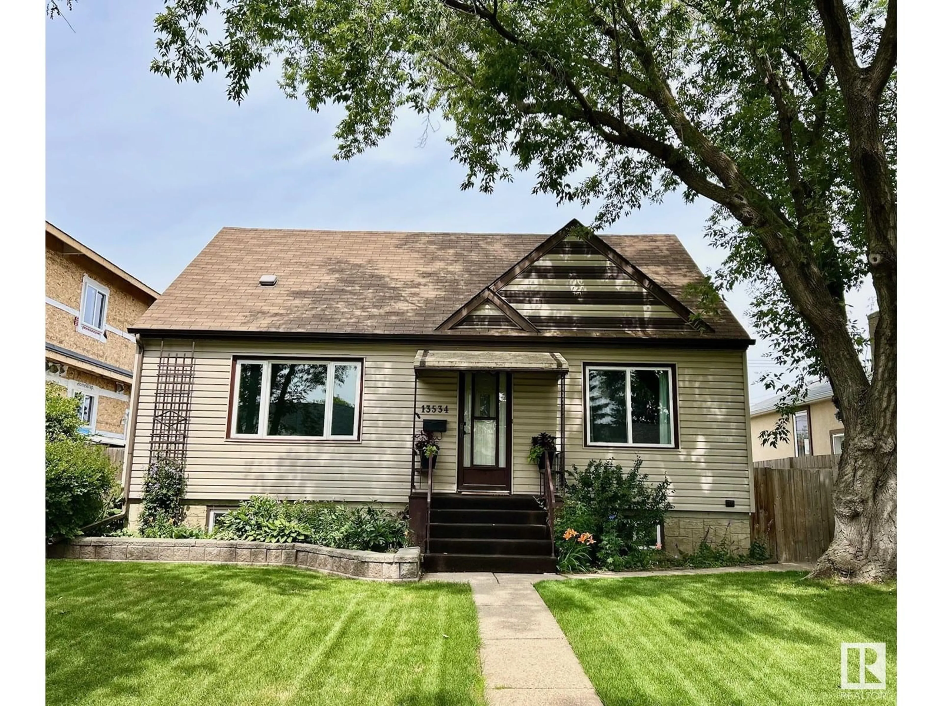 Home with vinyl exterior material, street for 13534 110A AV, Edmonton Alberta T5M2M9