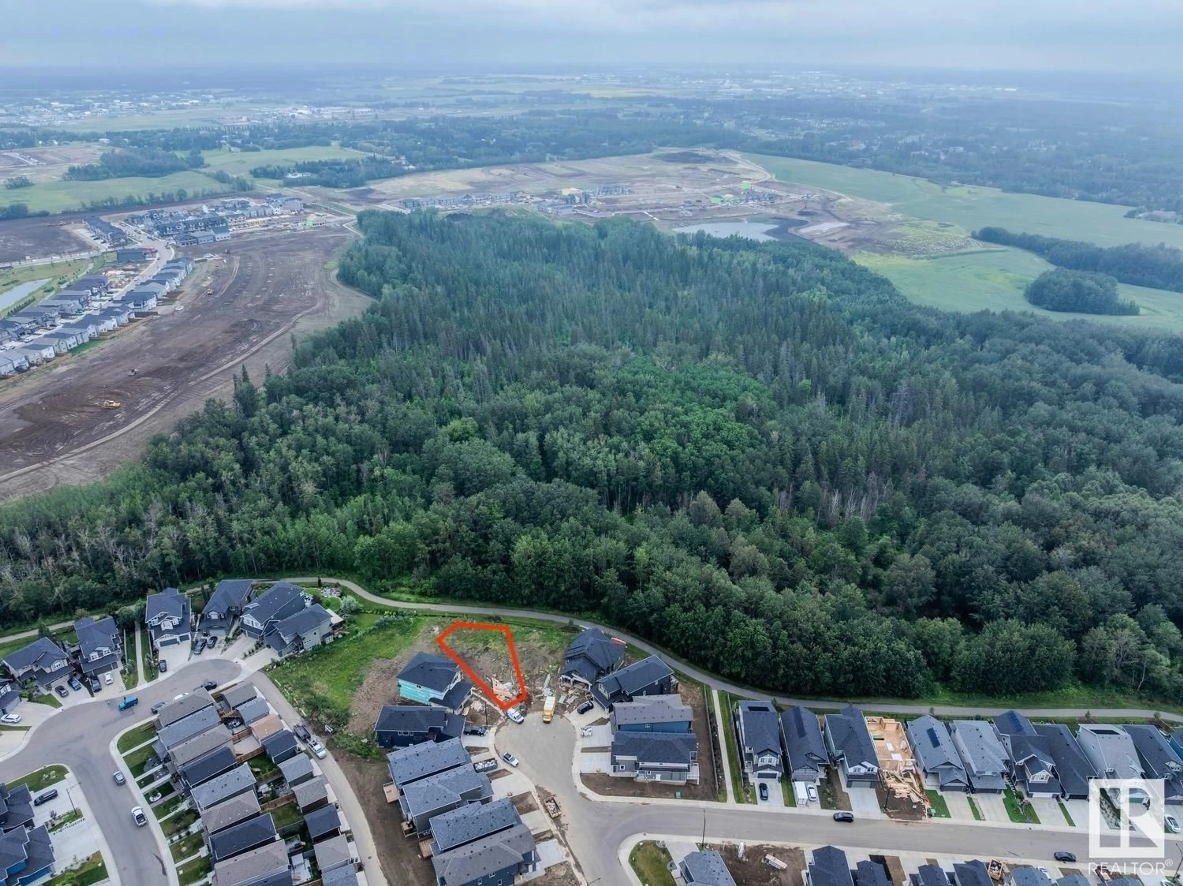 A pic from outside/outdoor area/front of a property/back of a property/a pic from drone, water/lake/river/ocean view for 1125 GYRFALCON CR, Edmonton Alberta T5S0S5