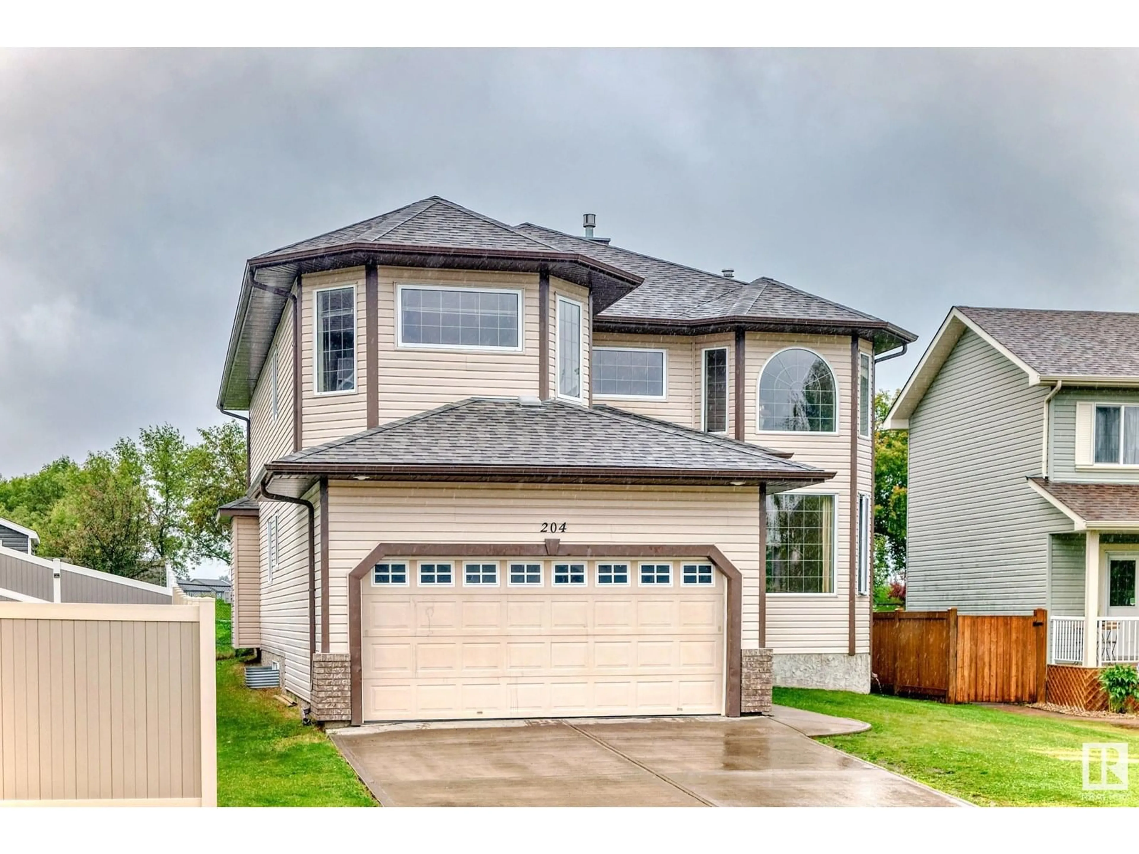 Home with vinyl exterior material, street for 204 REICHERT DR, Beaumont Alberta T4X0B9