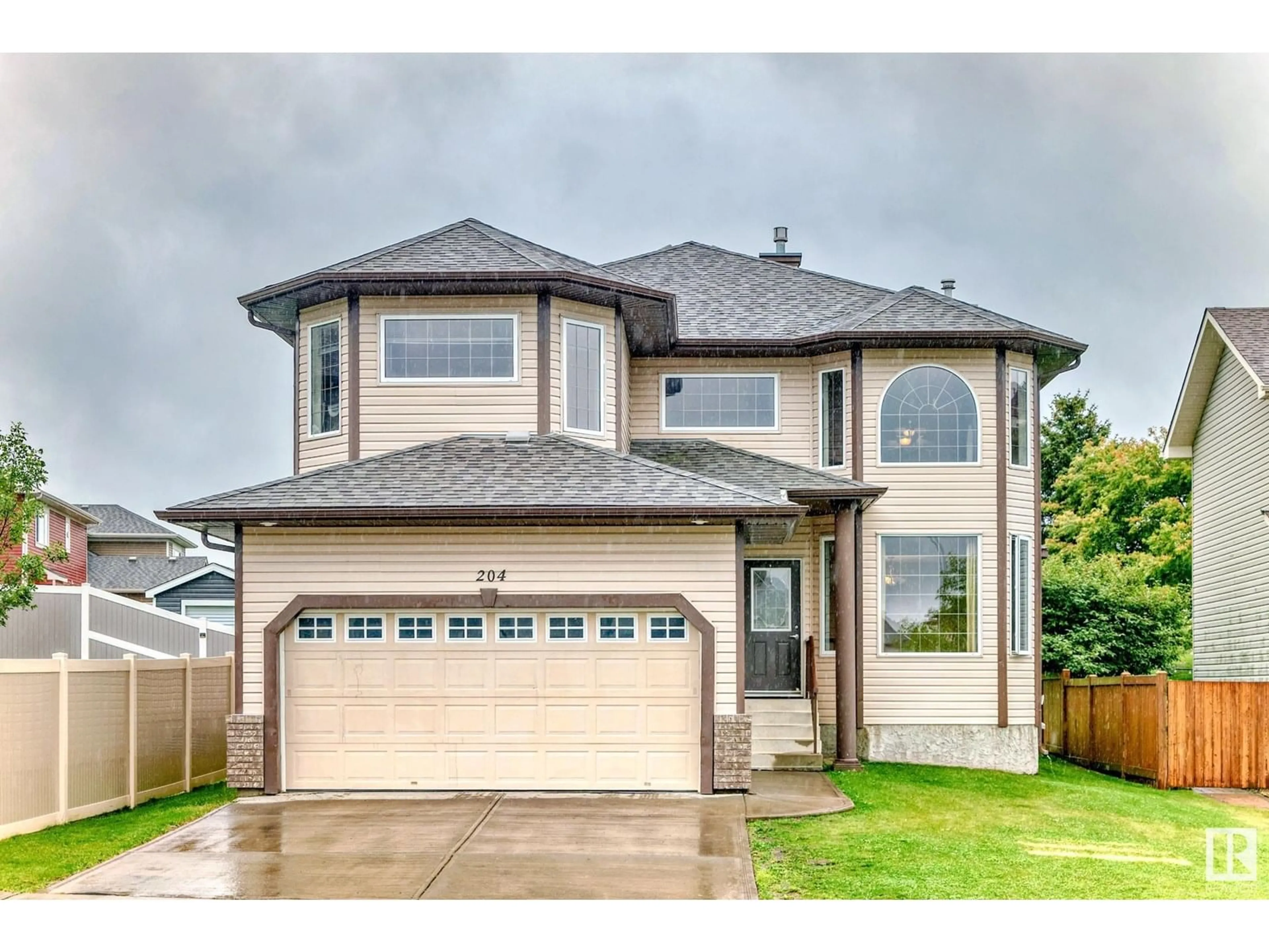 Home with vinyl exterior material, street for 204 REICHERT DR, Beaumont Alberta T4X0B9