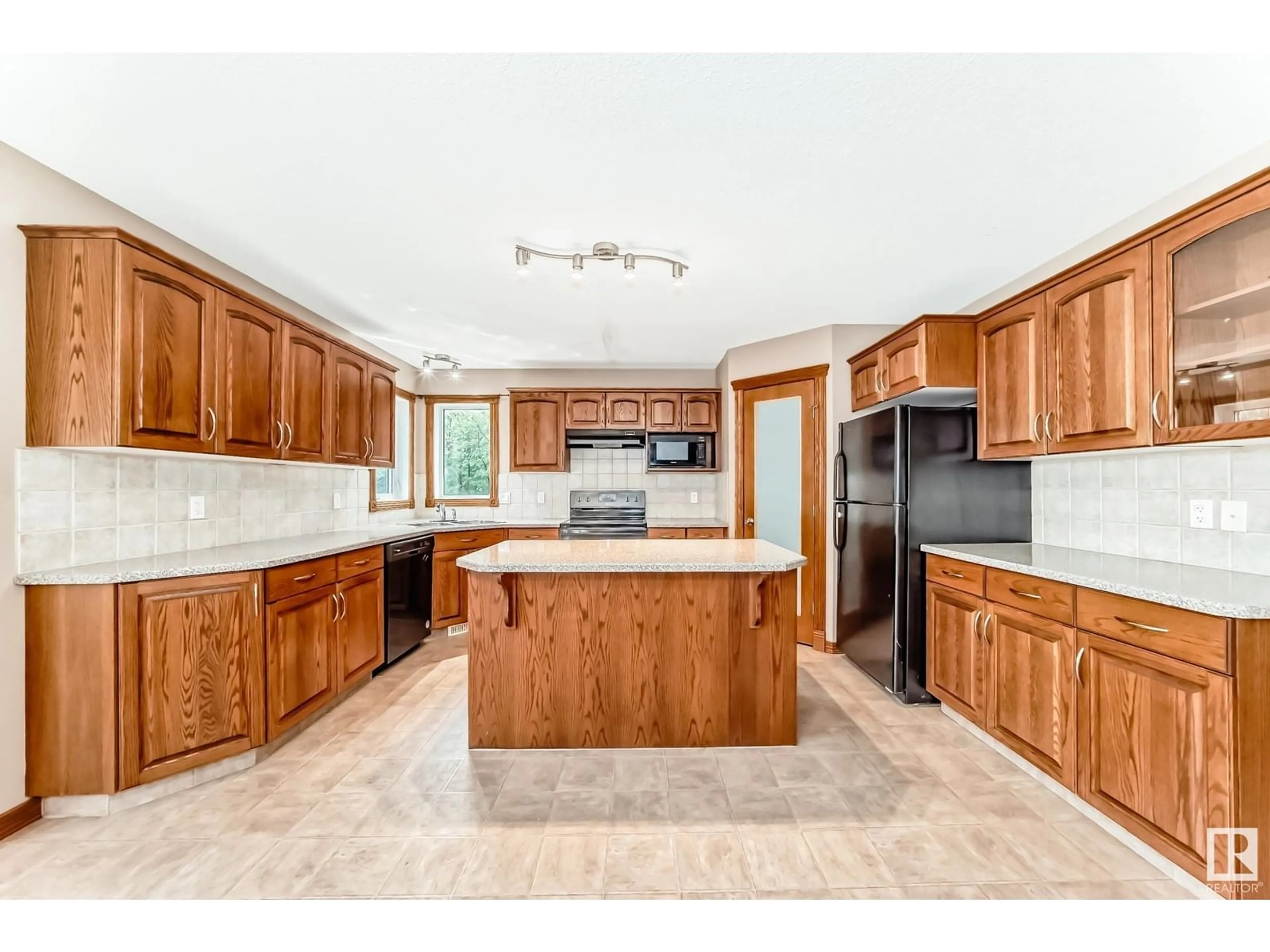 Open concept kitchen, ceramic/tile floor for 204 REICHERT DR, Beaumont Alberta T4X0B9