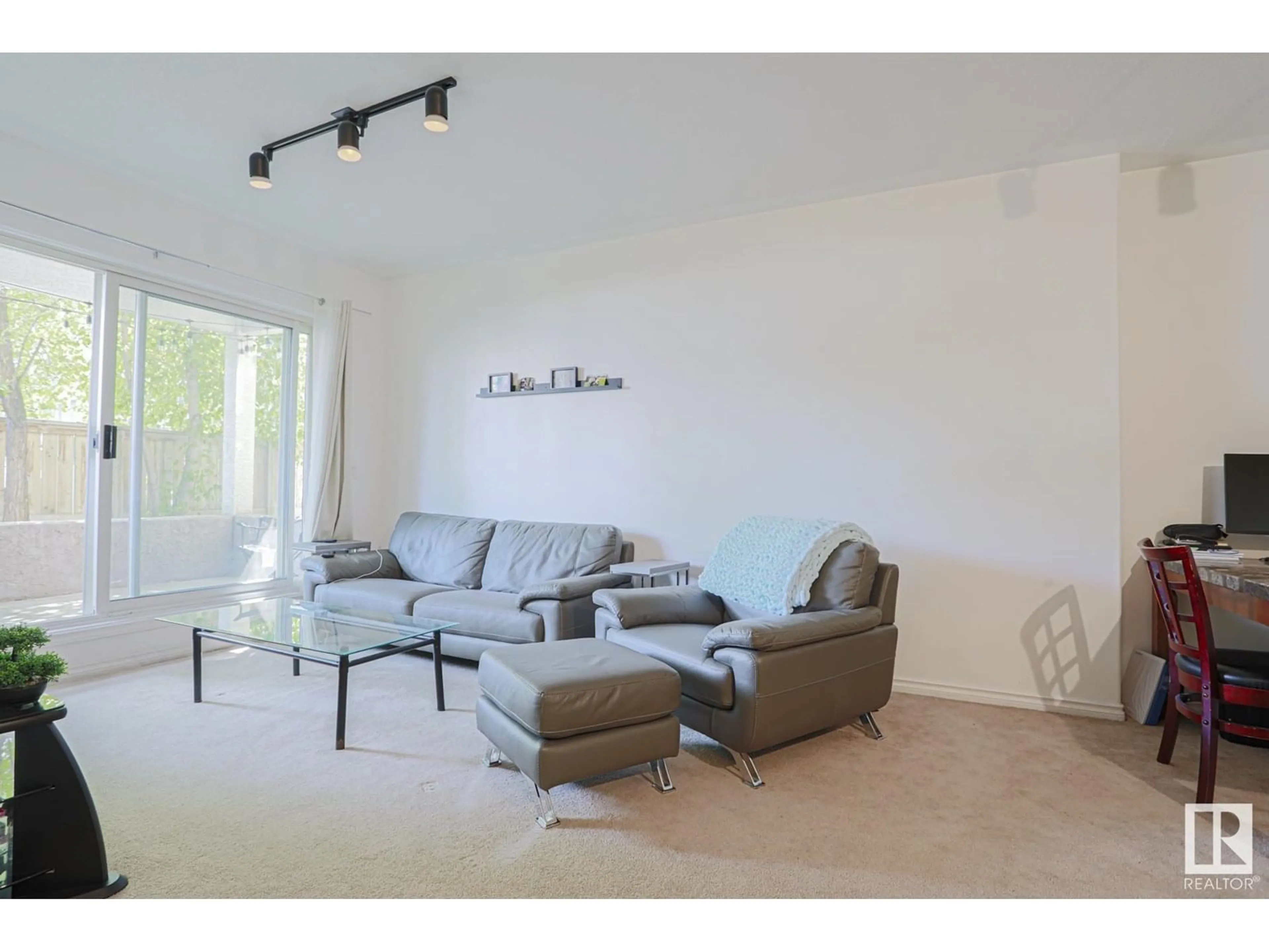Living room with furniture, unknown for #103 - 10033 116 ST, Edmonton Alberta T5K2X5