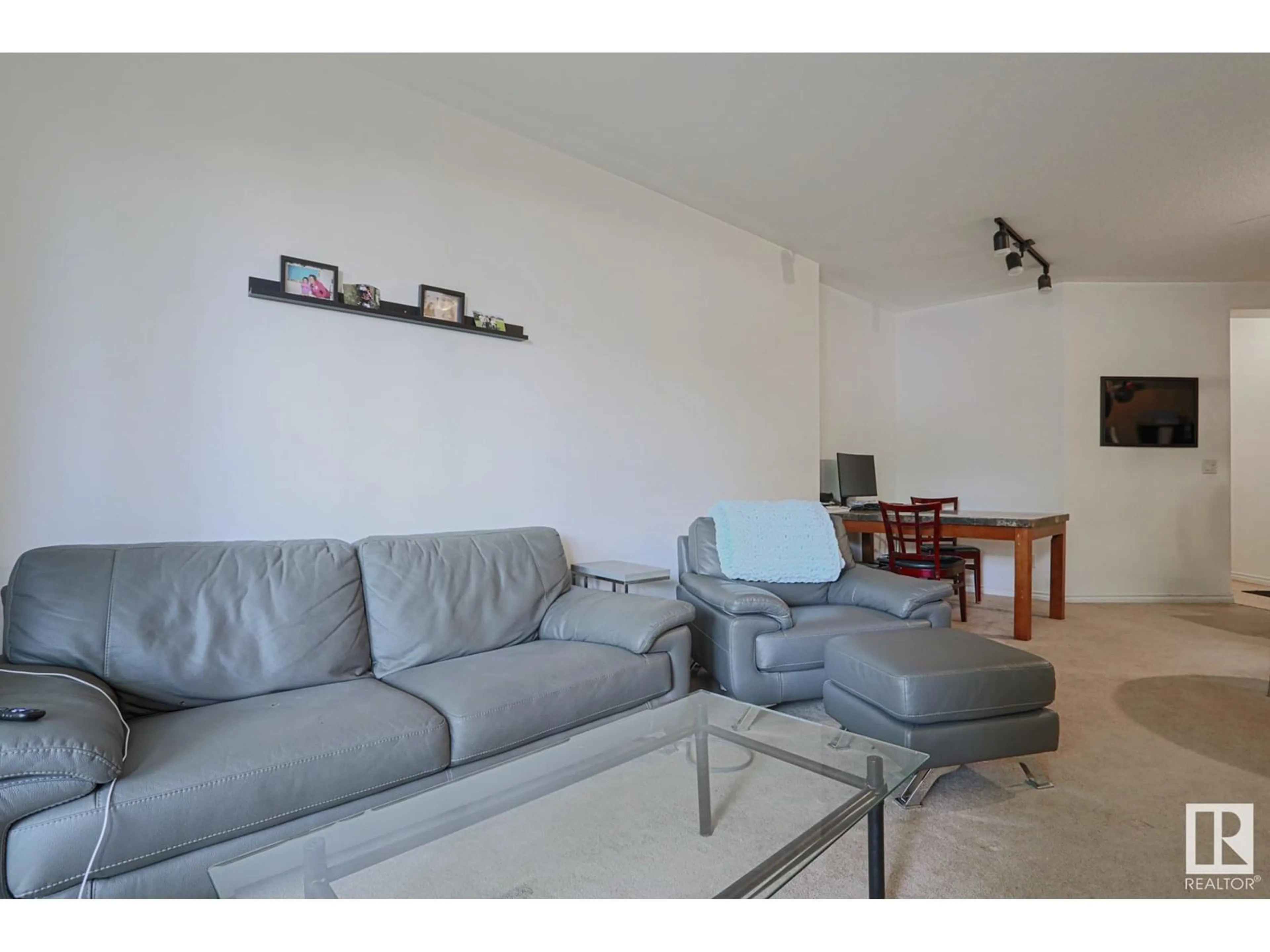 Living room with furniture, unknown for #103 - 10033 116 ST, Edmonton Alberta T5K2X5