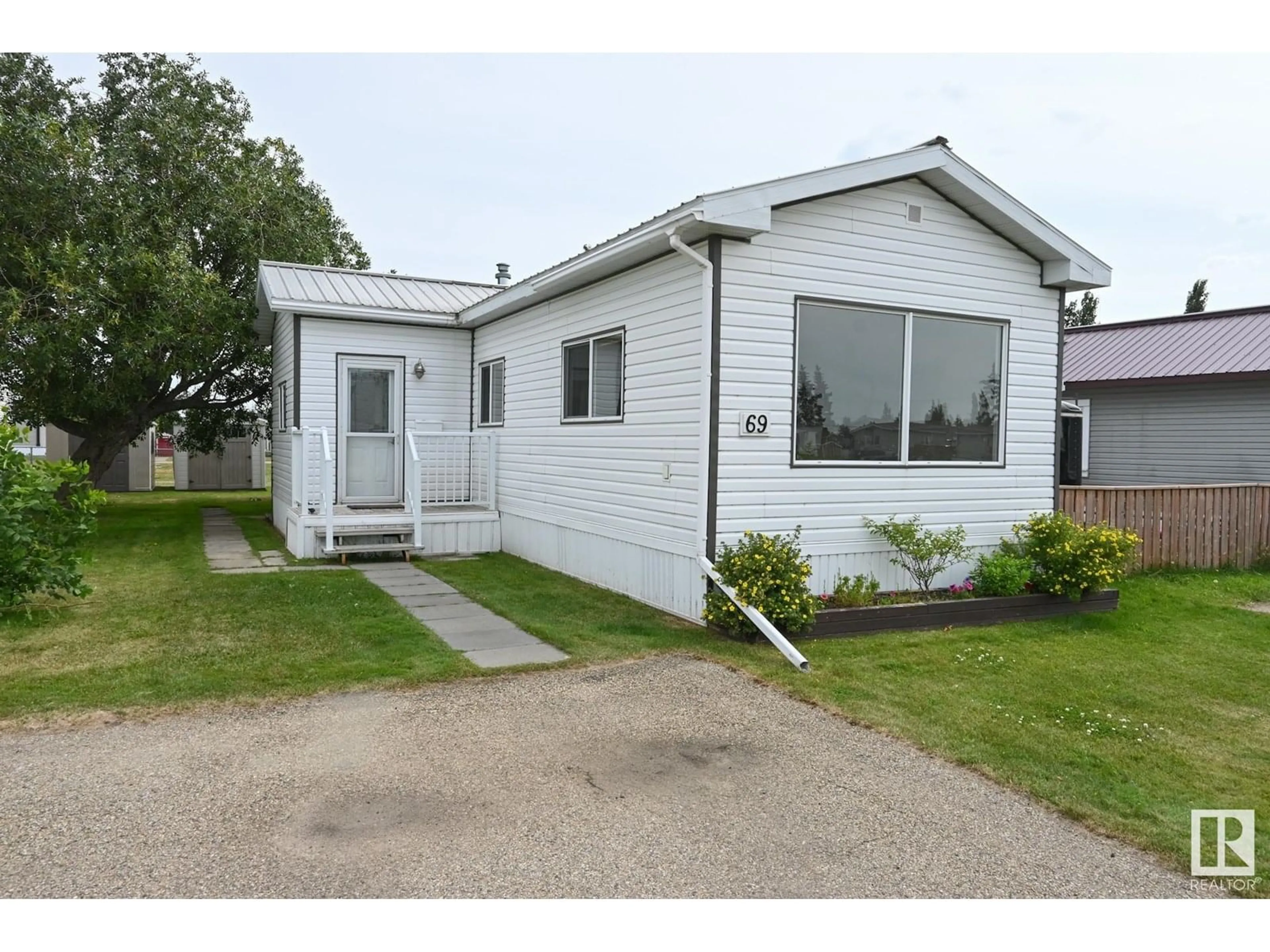 Home with vinyl exterior material, street for 4819 51, Millet Alberta T0C1Z0