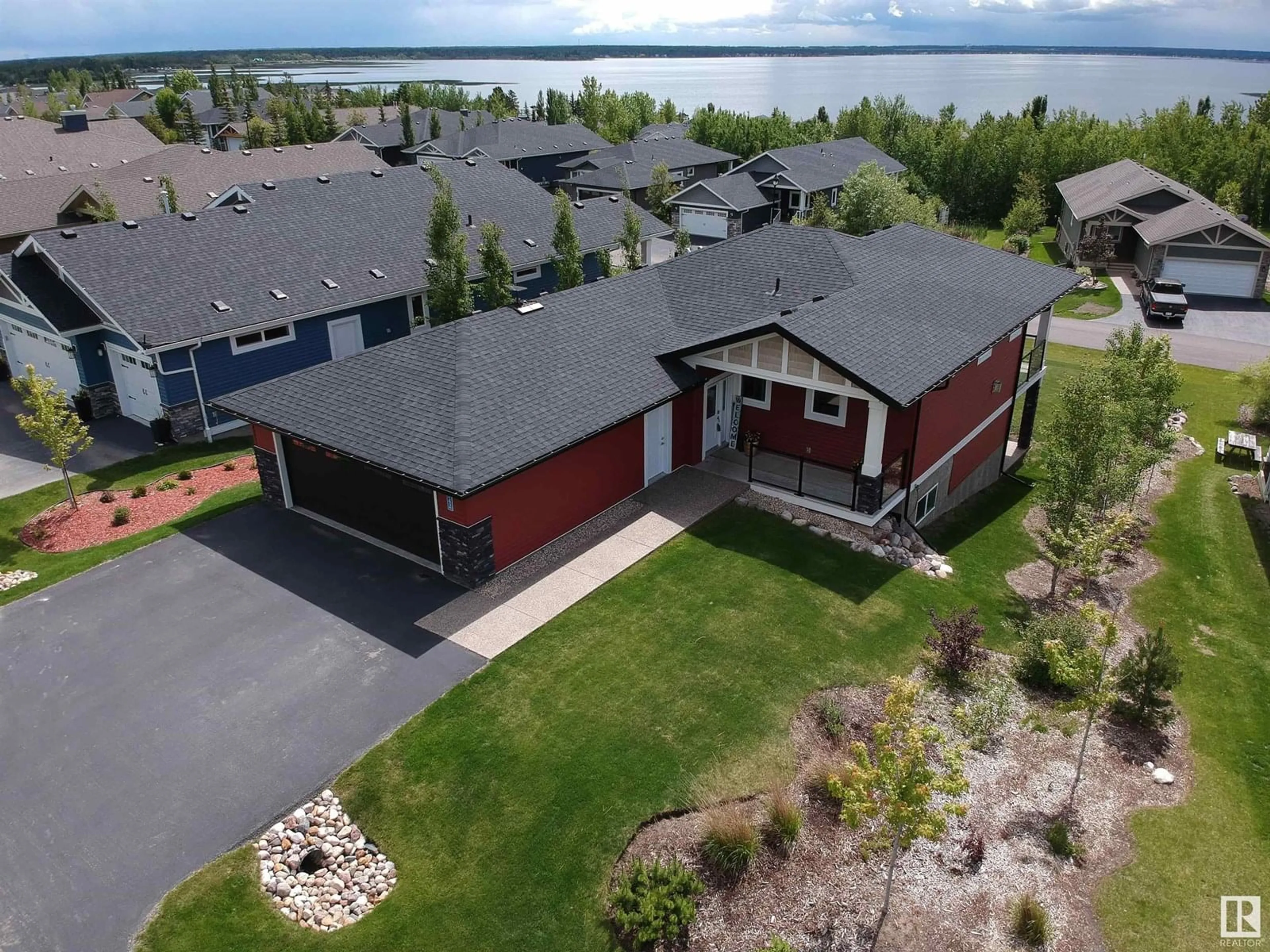 A pic from outside/outdoor area/front of a property/back of a property/a pic from drone, water/lake/river/ocean view for 55101 STE. ANNE TR, Rural Lac Ste. Anne County Alberta T0E1A0