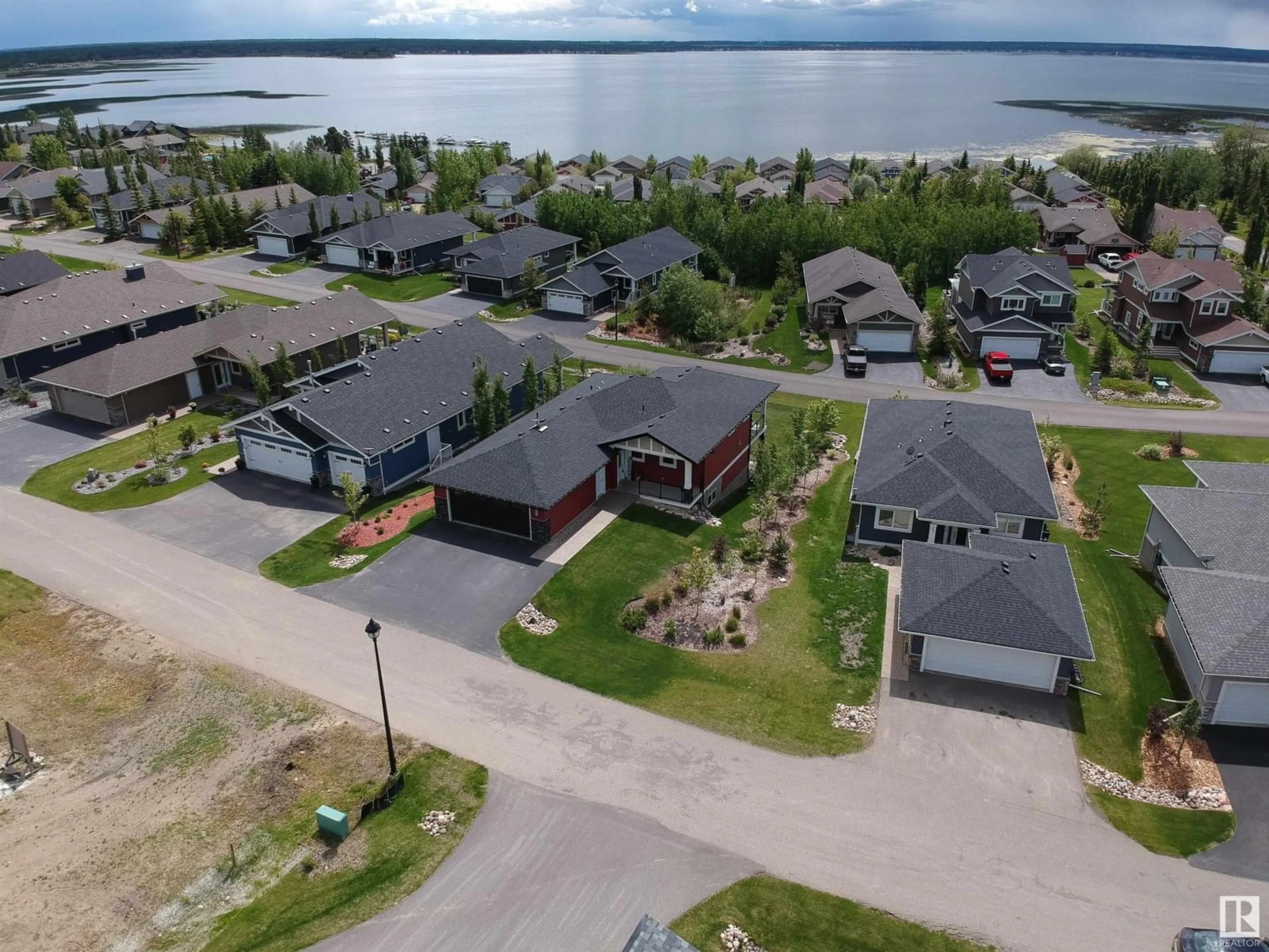 A pic from outside/outdoor area/front of a property/back of a property/a pic from drone, water/lake/river/ocean view for 55101 STE. ANNE TR, Rural Lac Ste. Anne County Alberta T0E1A0