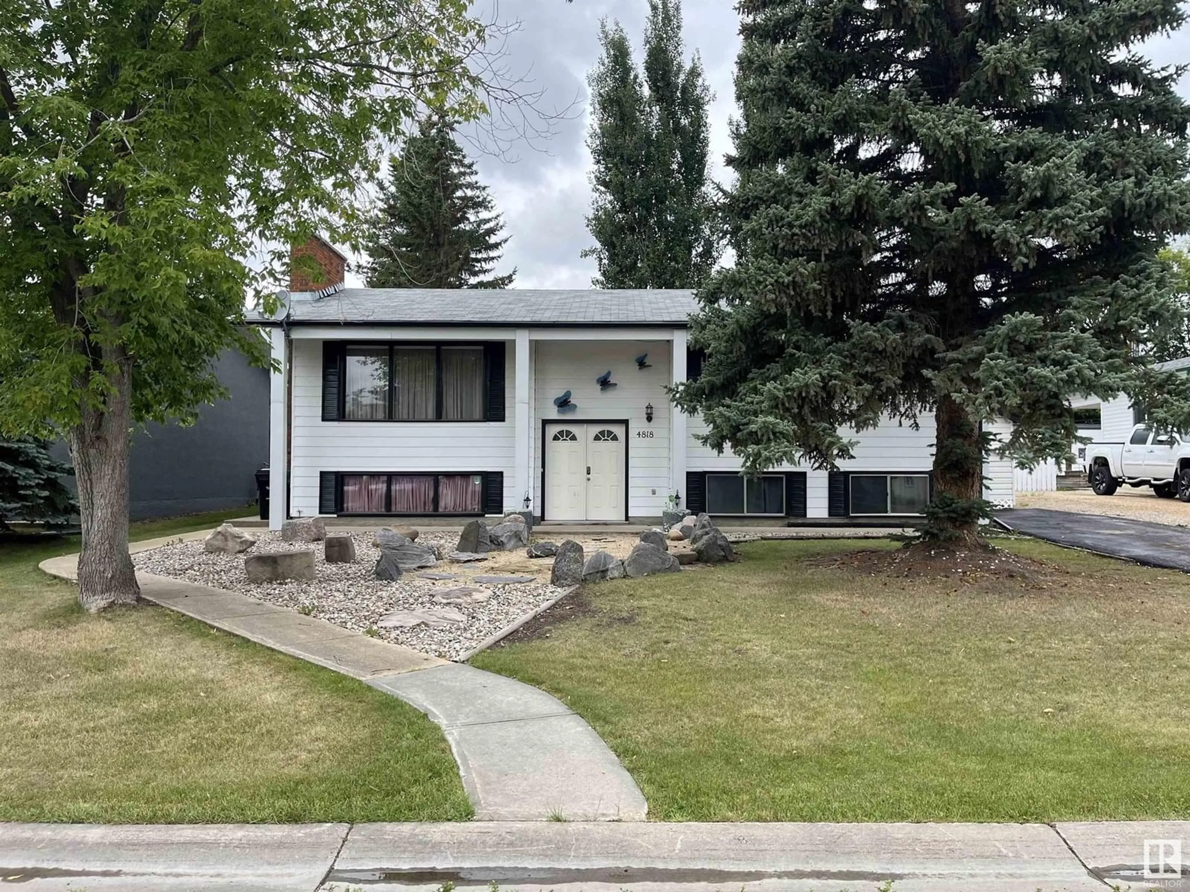 Home with vinyl exterior material, street for 4818 50 ST, Barrhead Alberta T7N1G4