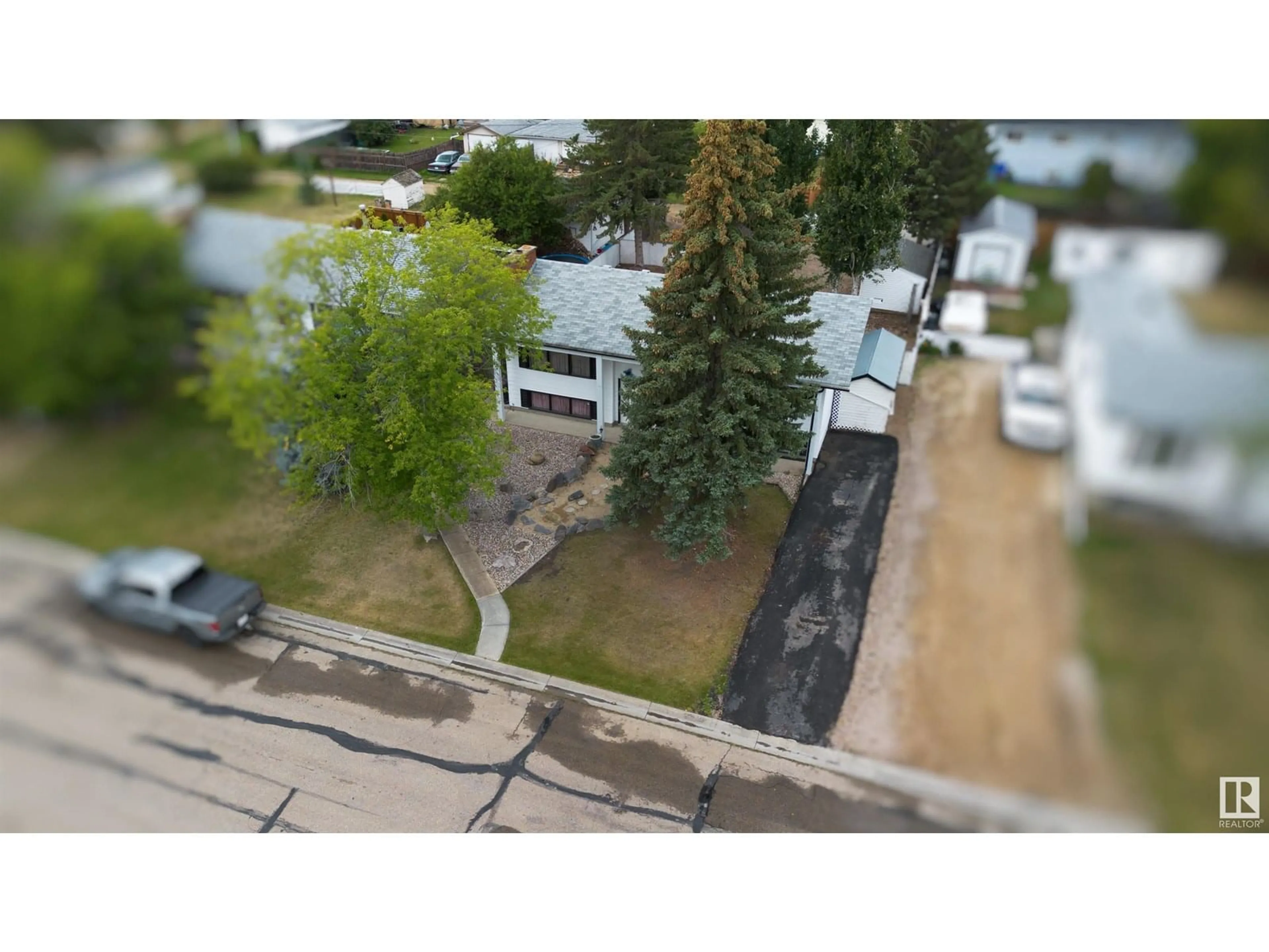 A pic from outside/outdoor area/front of a property/back of a property/a pic from drone, street for 4818 50 ST, Barrhead Alberta T7N1G4