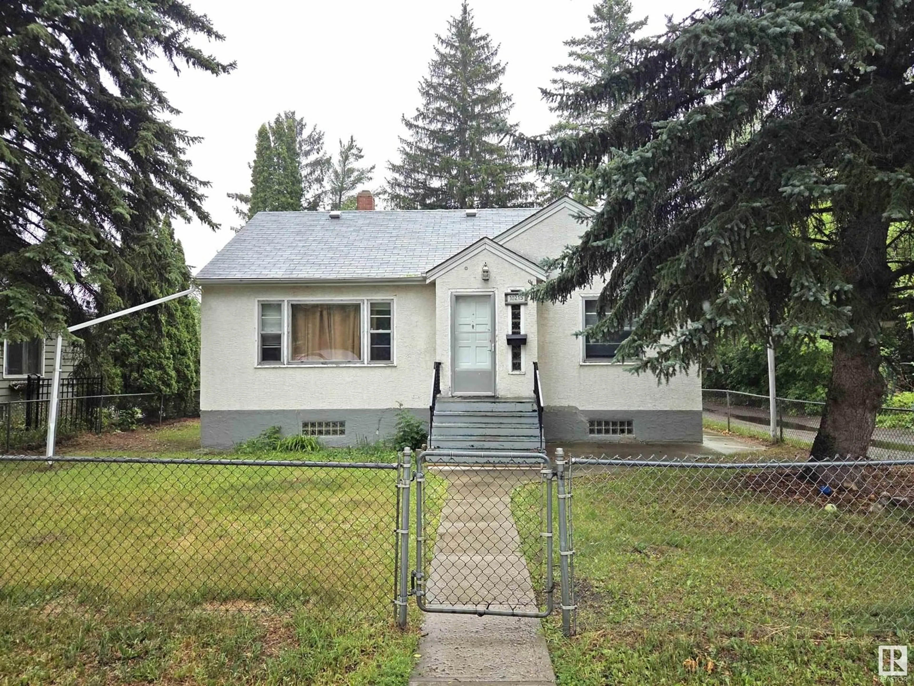 Home with vinyl exterior material, street for 10215 138 ST, Edmonton Alberta T5N2H9