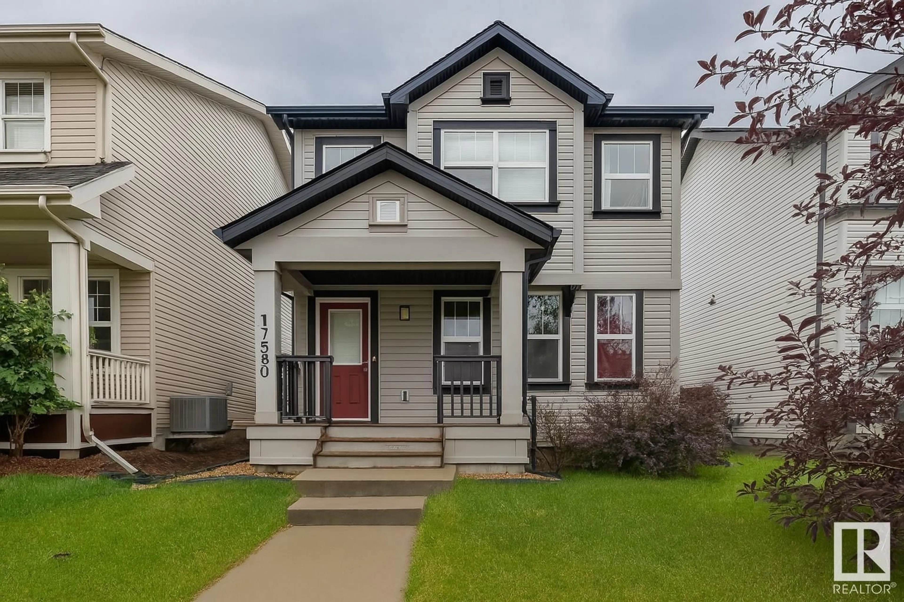 Home with vinyl exterior material, street for 17580 58 ST, Edmonton Alberta T5Y0V2