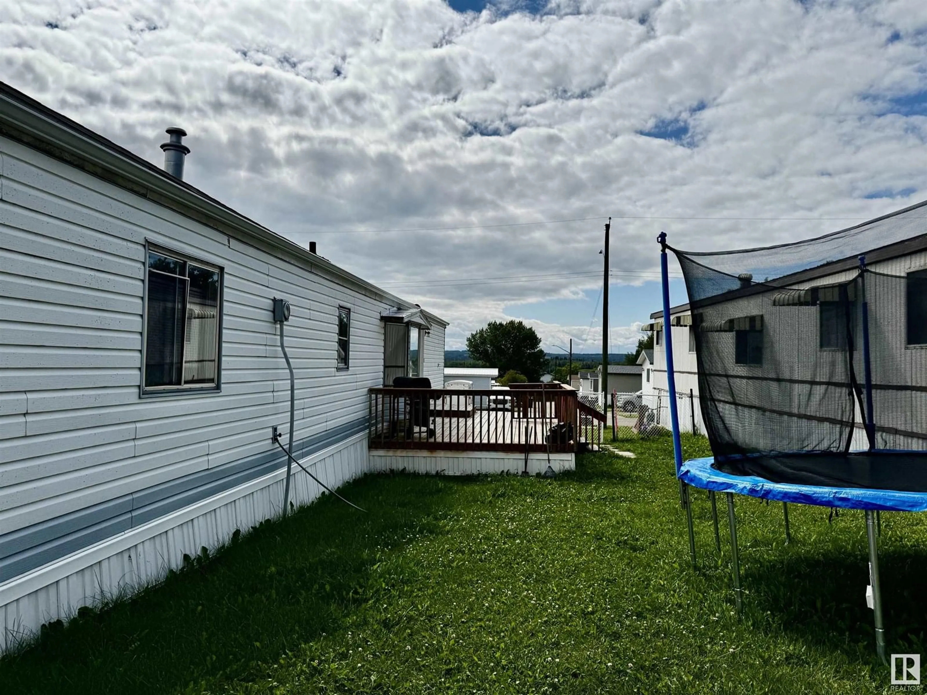 A pic from outside/outdoor area/front of a property/back of a property/a pic from drone, water/lake/river/ocean view for 79 - 2251 50 ST, Drayton Valley Alberta T7A1M9