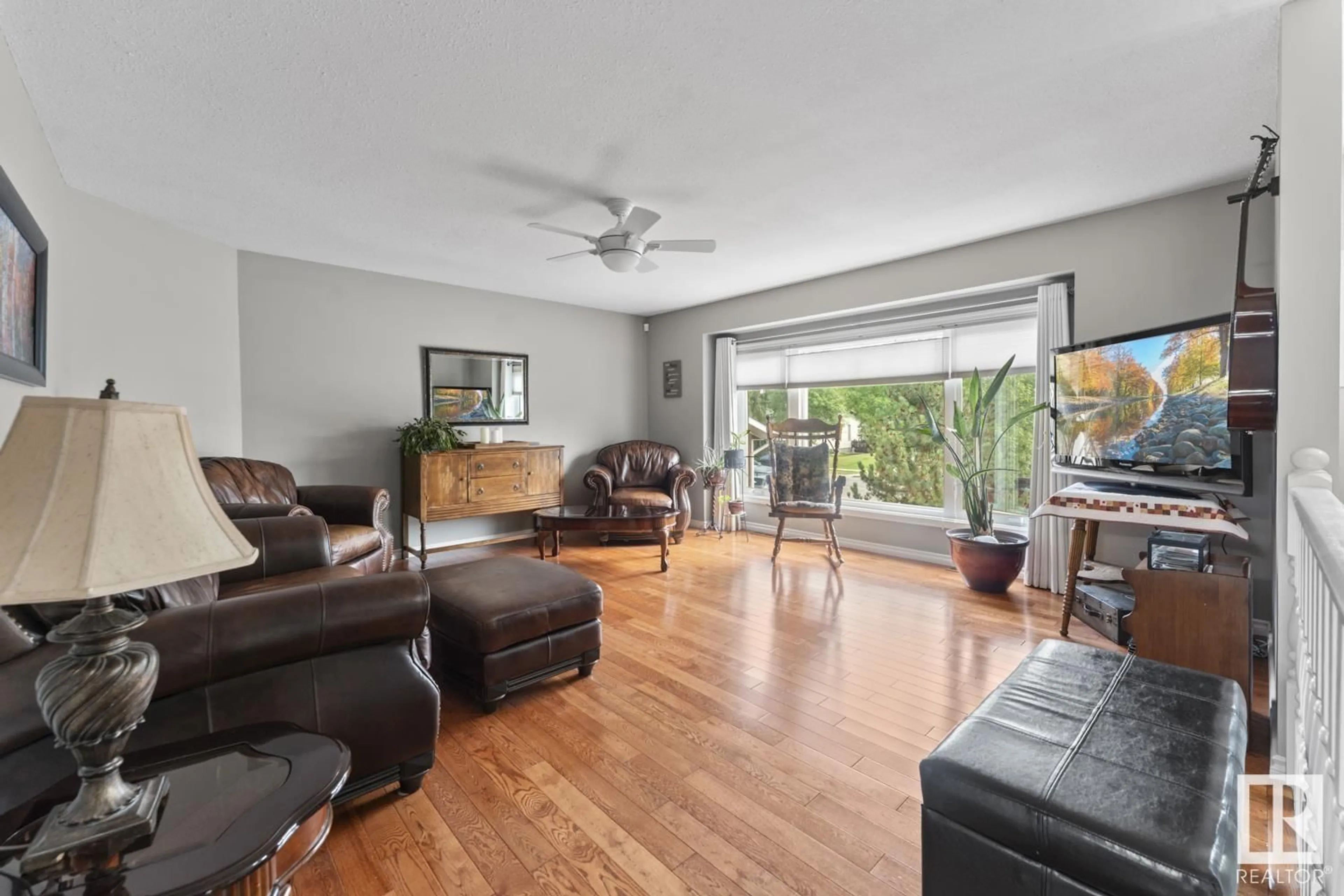 Living room with furniture, wood/laminate floor for 4115 40 AV, Bonnyville Town Alberta T9N1T9