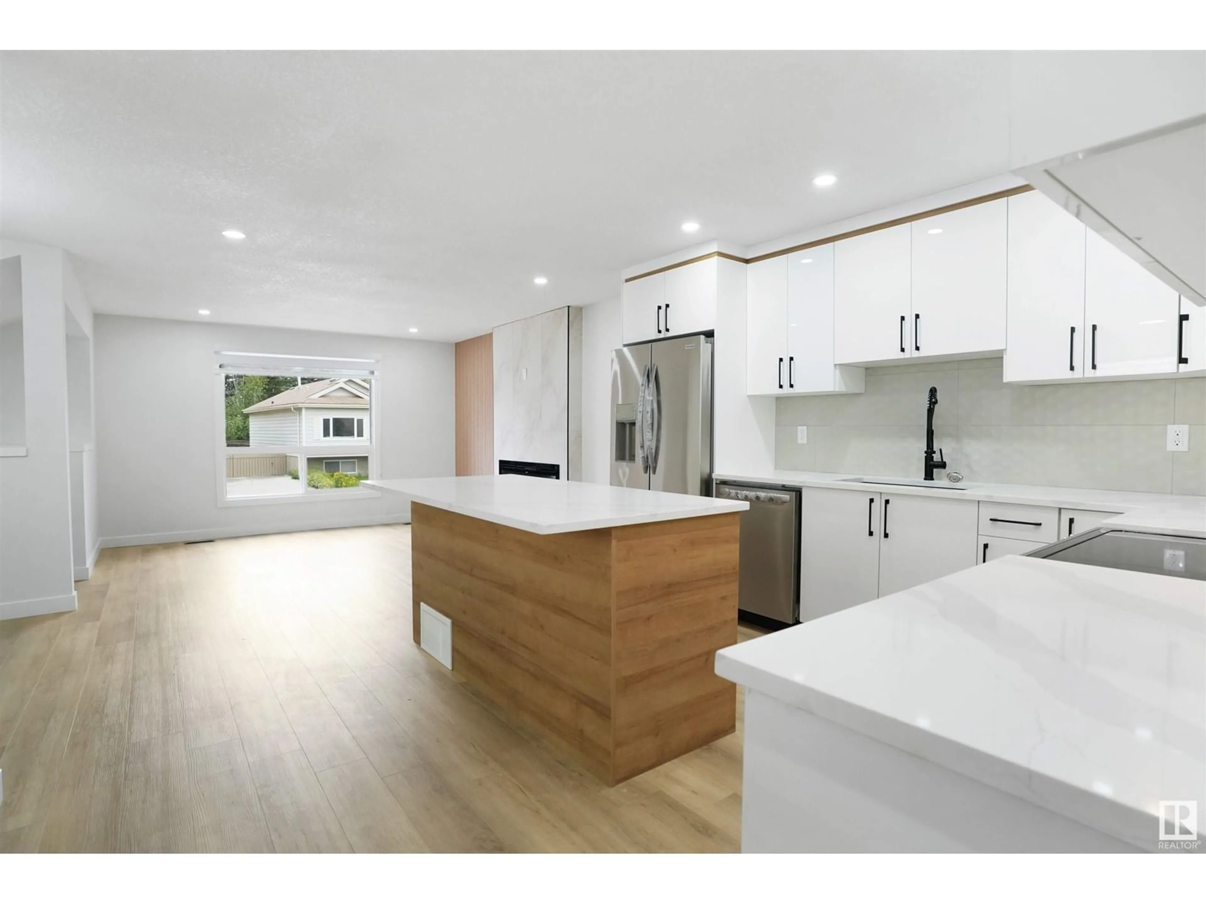 Open concept kitchen, wood/laminate floor for 18416 95A AV, Edmonton Alberta T5T3V8