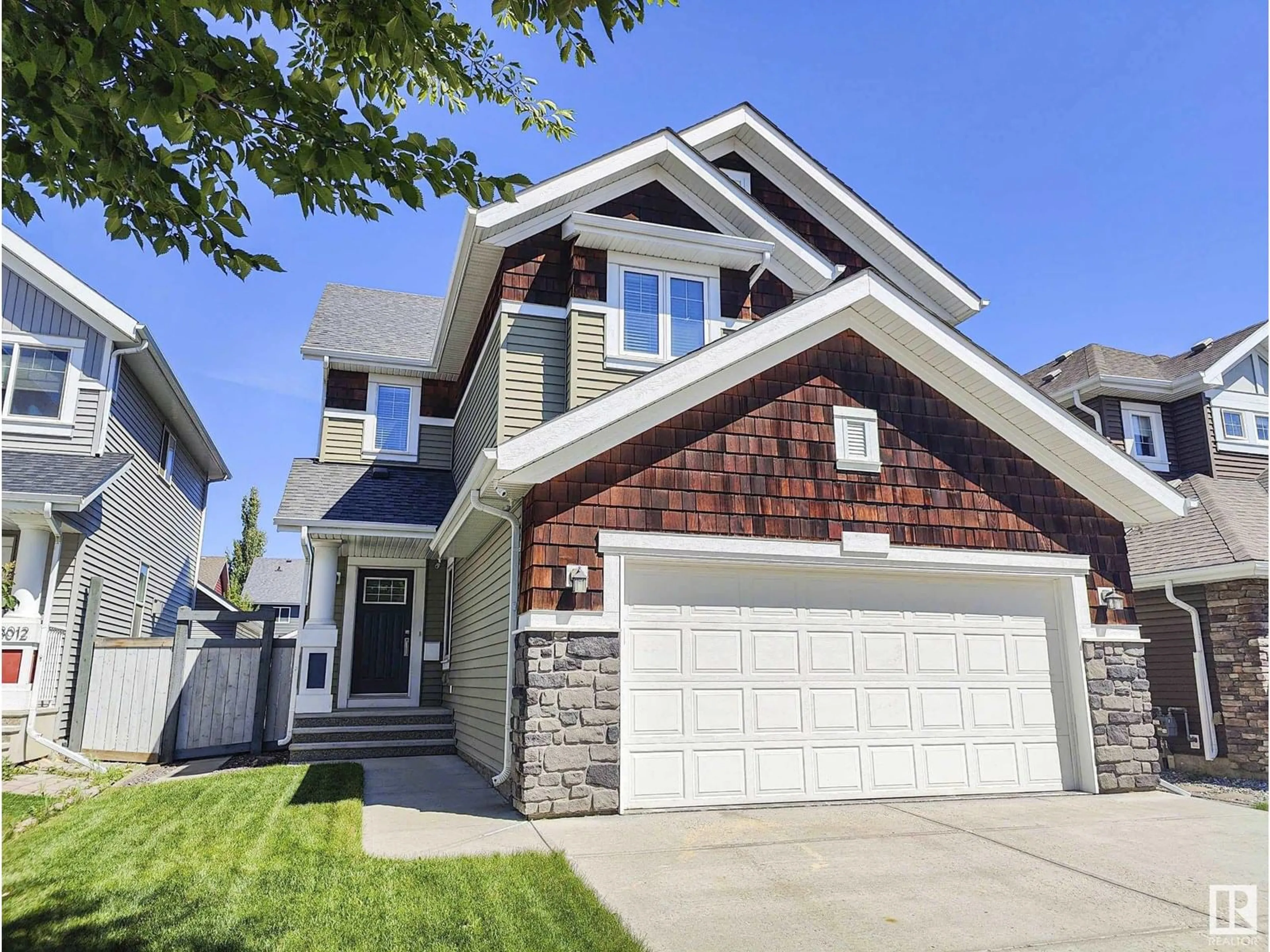 Home with vinyl exterior material, street for 8008 18 AV, Edmonton Alberta T6X0Z8