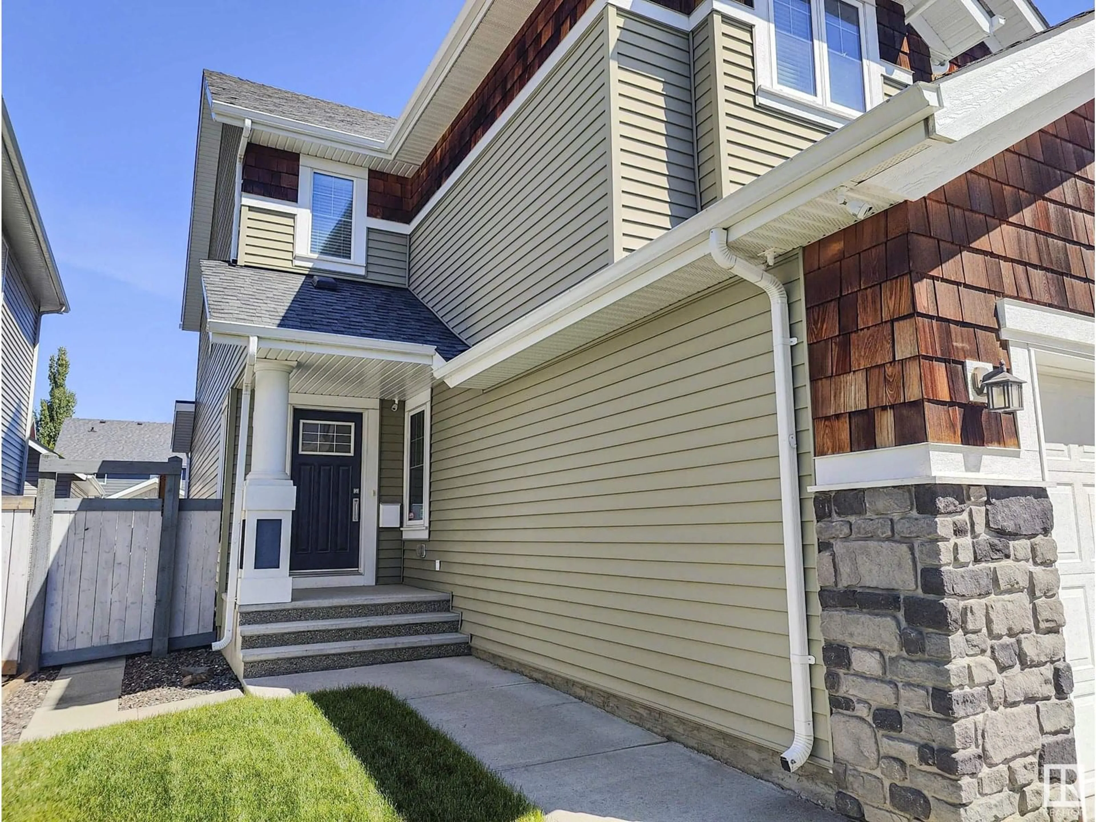 Home with vinyl exterior material, street for 8008 18 AV, Edmonton Alberta T6X0Z8