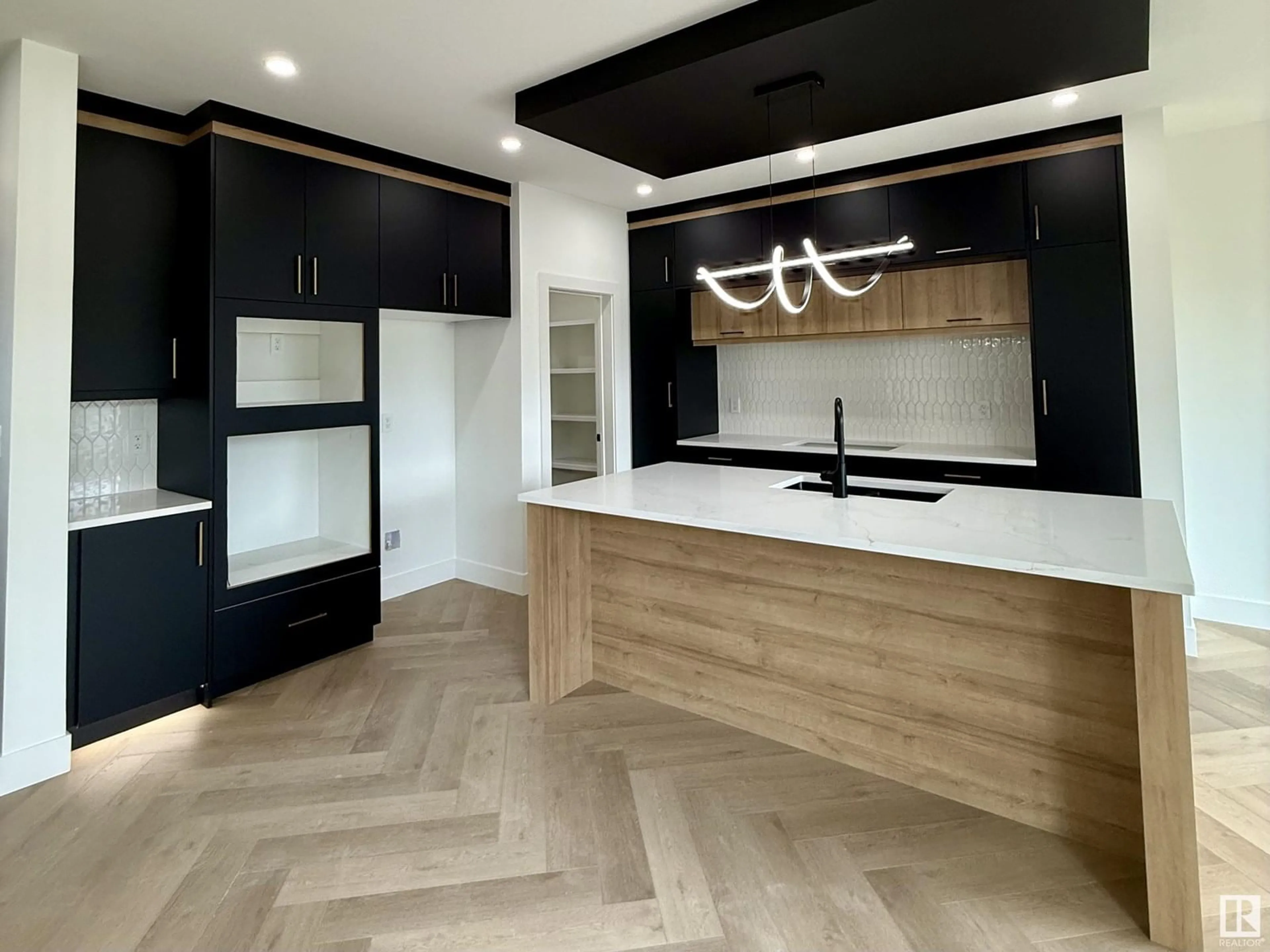 Open concept kitchen, wood/laminate floor for 3248 PELERIN CR, Beaumont Alberta T4X2Z1