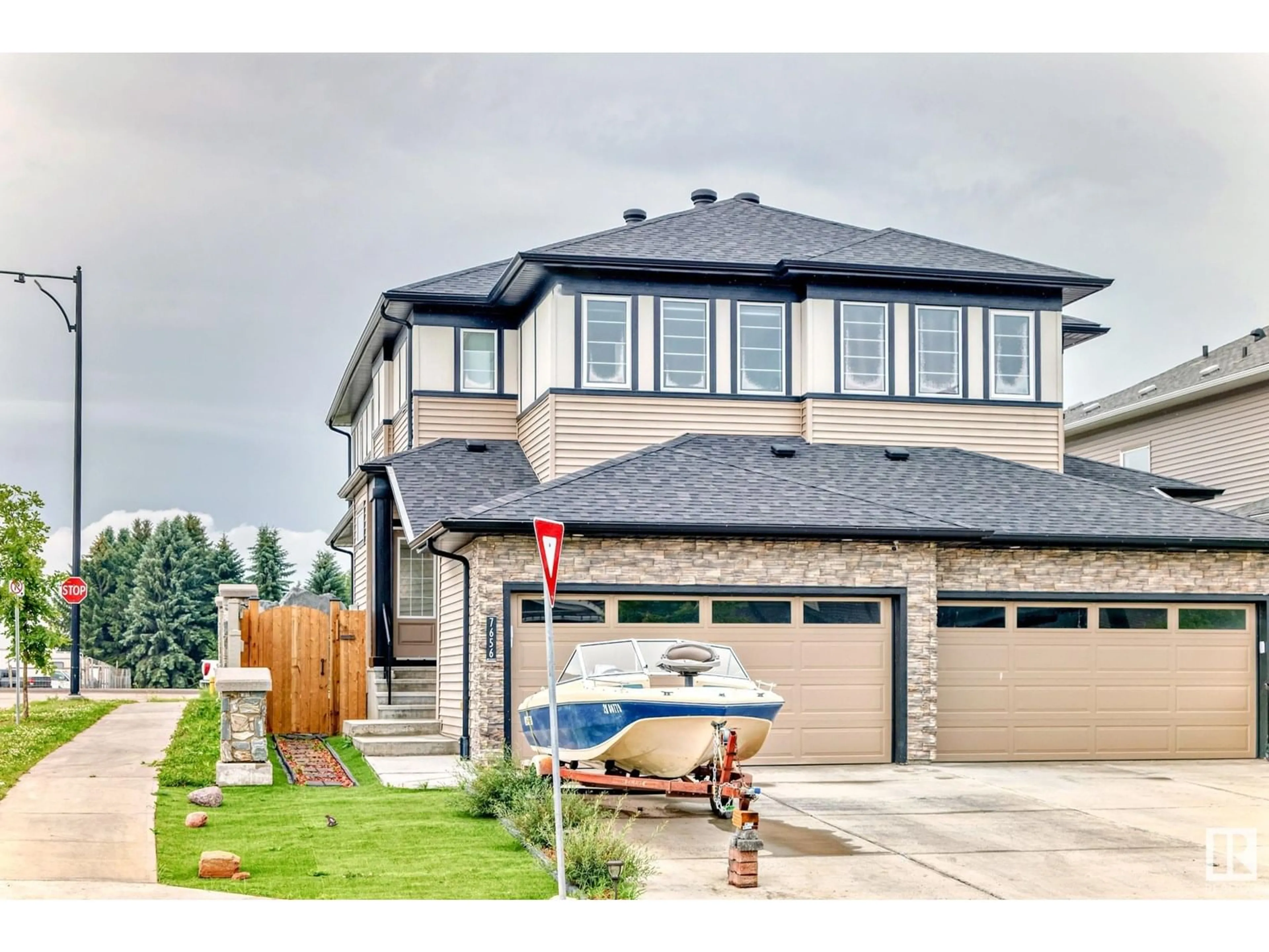 Home with brick exterior material, street for SW - 7656 CREIGHTON PL, Edmonton Alberta T6W3Z5