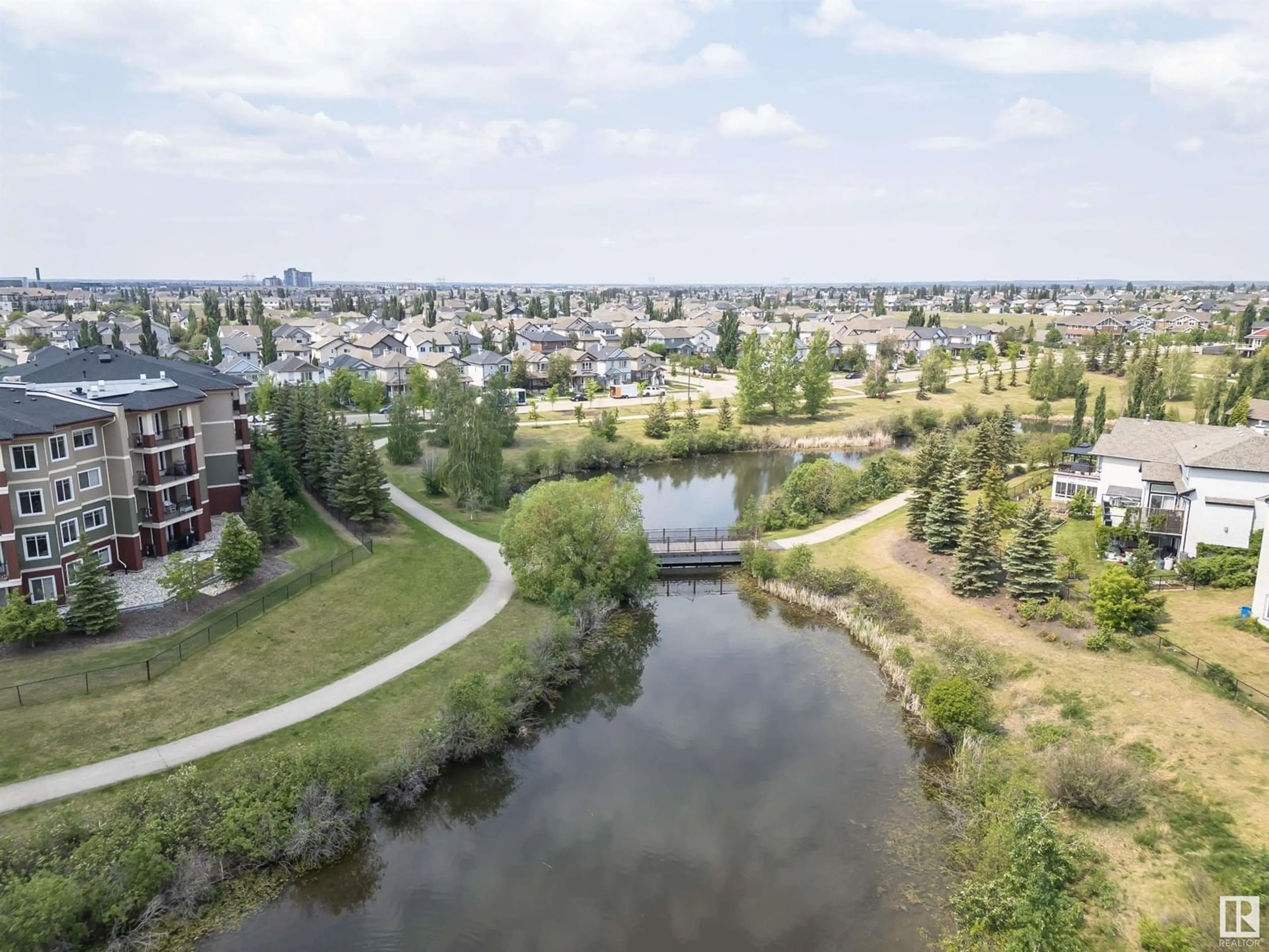 A pic from outside/outdoor area/front of a property/back of a property/a pic from drone, water/lake/river/ocean view for 7363 SINGER WY, Edmonton Alberta T6R3S1