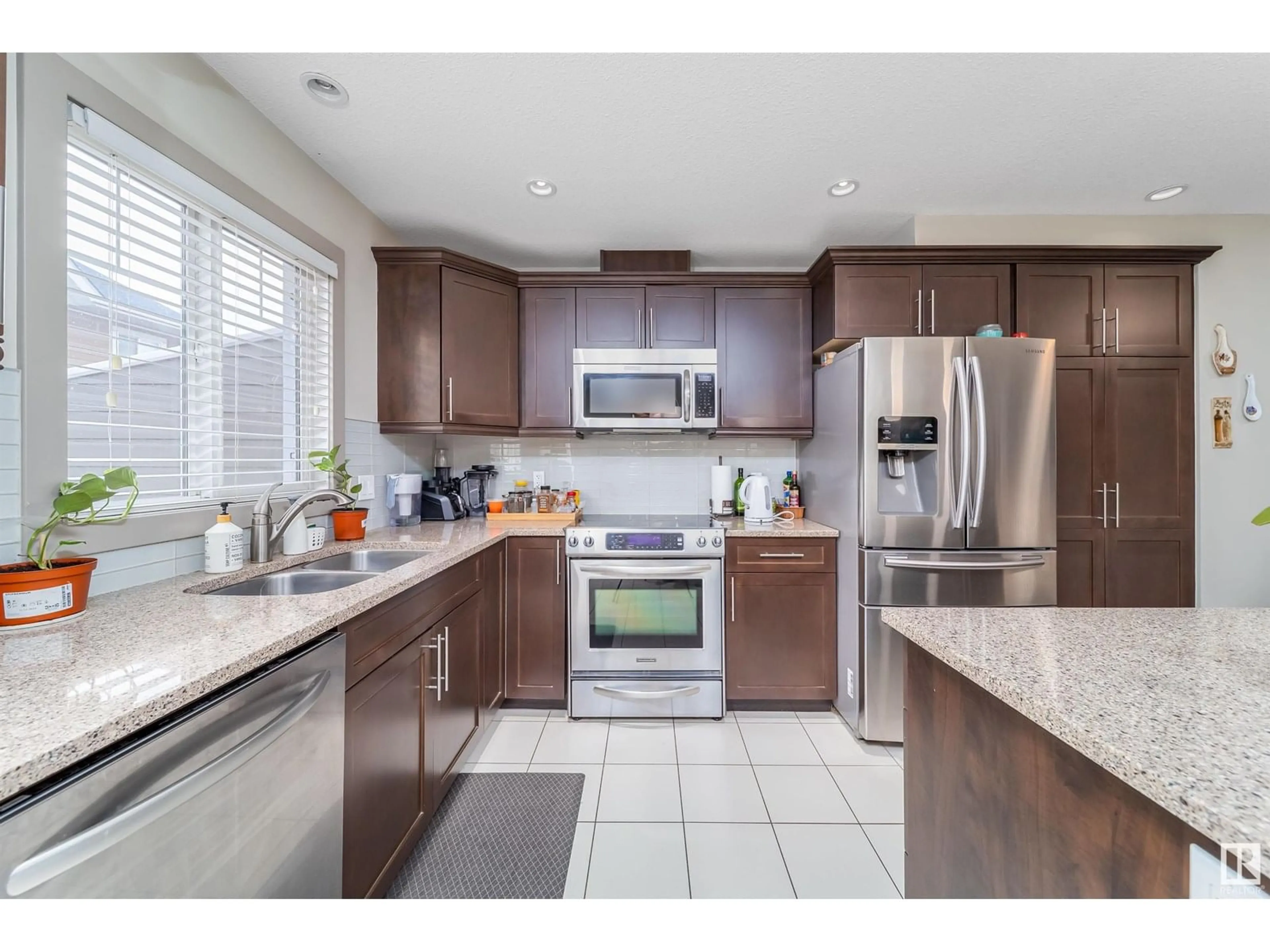 Open concept kitchen, ceramic/tile floor for 1150 - 20 WINDERMERE WY, Edmonton Alberta T6W2B6