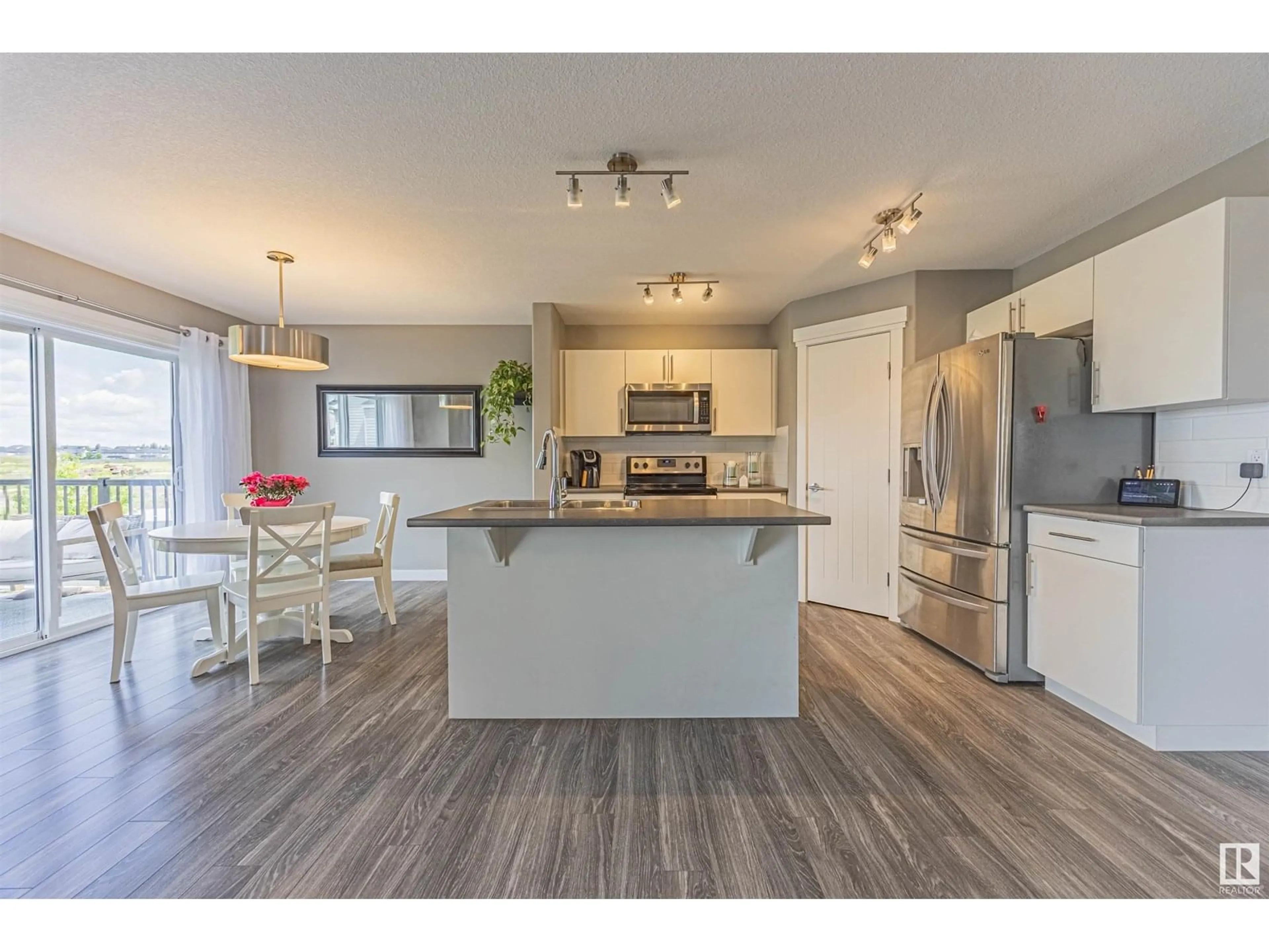 Open concept kitchen, wood/laminate floor for 6406 61 AV, Beaumont Alberta T4X1Z2