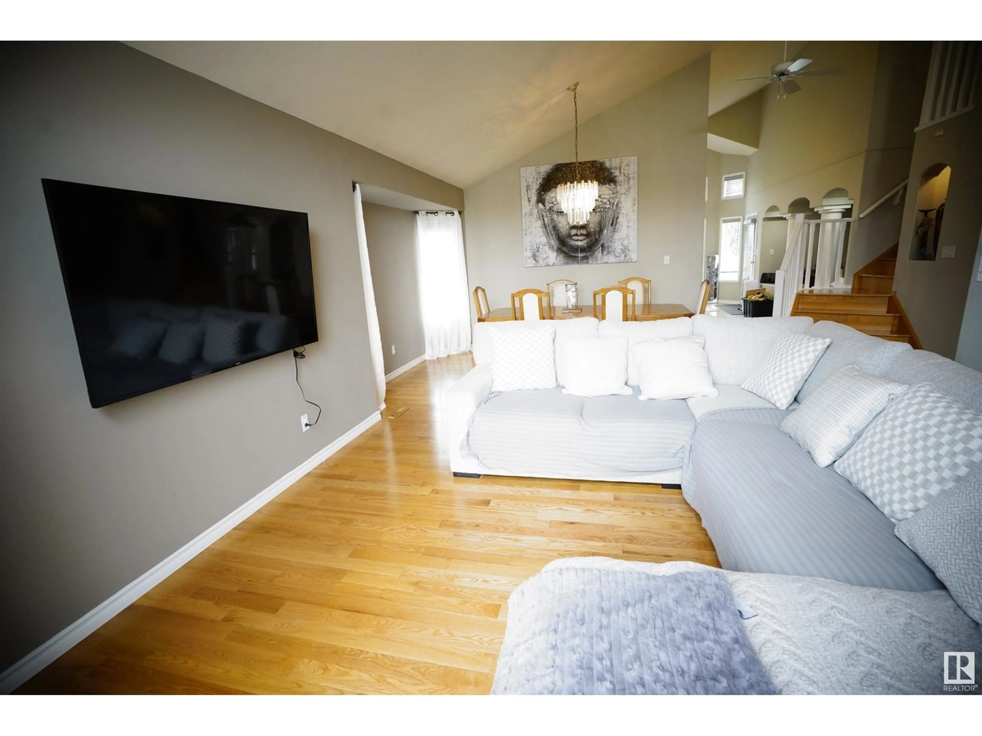 Living room with furniture, wood/laminate floor for NW - 15716 68 ST, Edmonton Alberta T5Z3A4