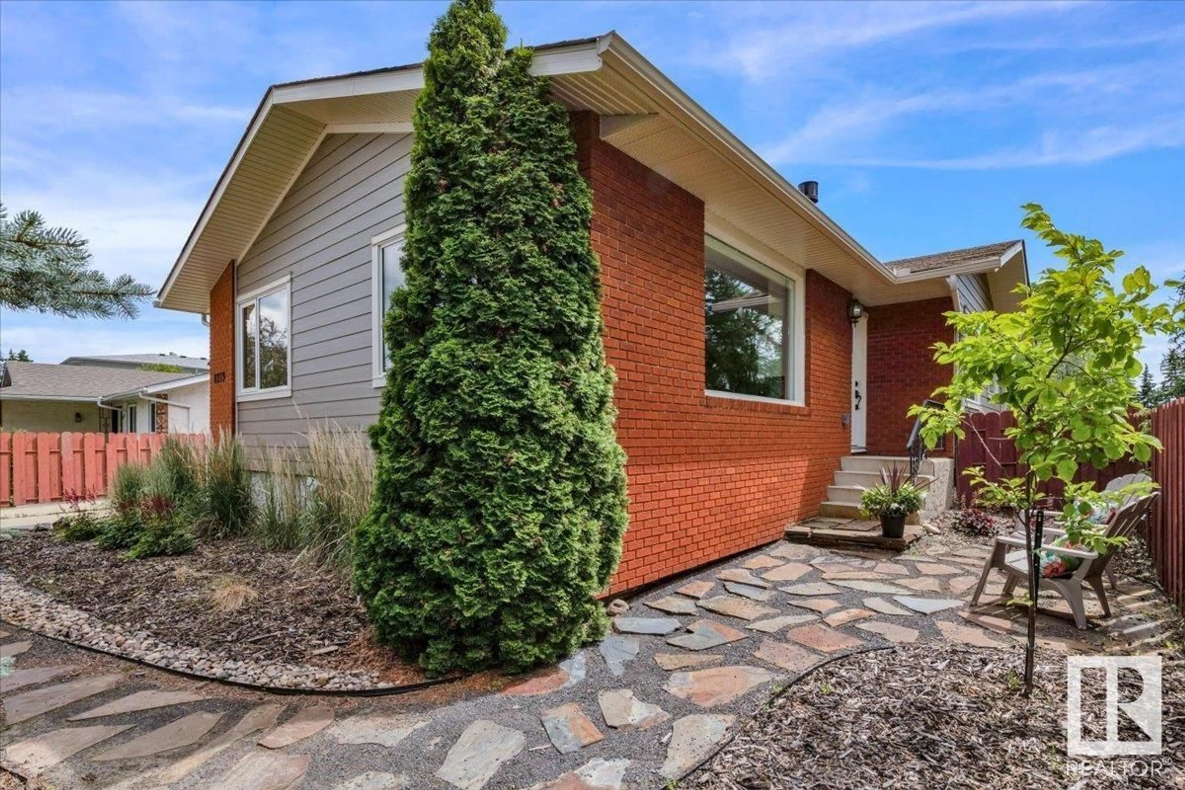 Home with brick exterior material, street for 8219 17 AV NW, Edmonton Alberta T6K2C7