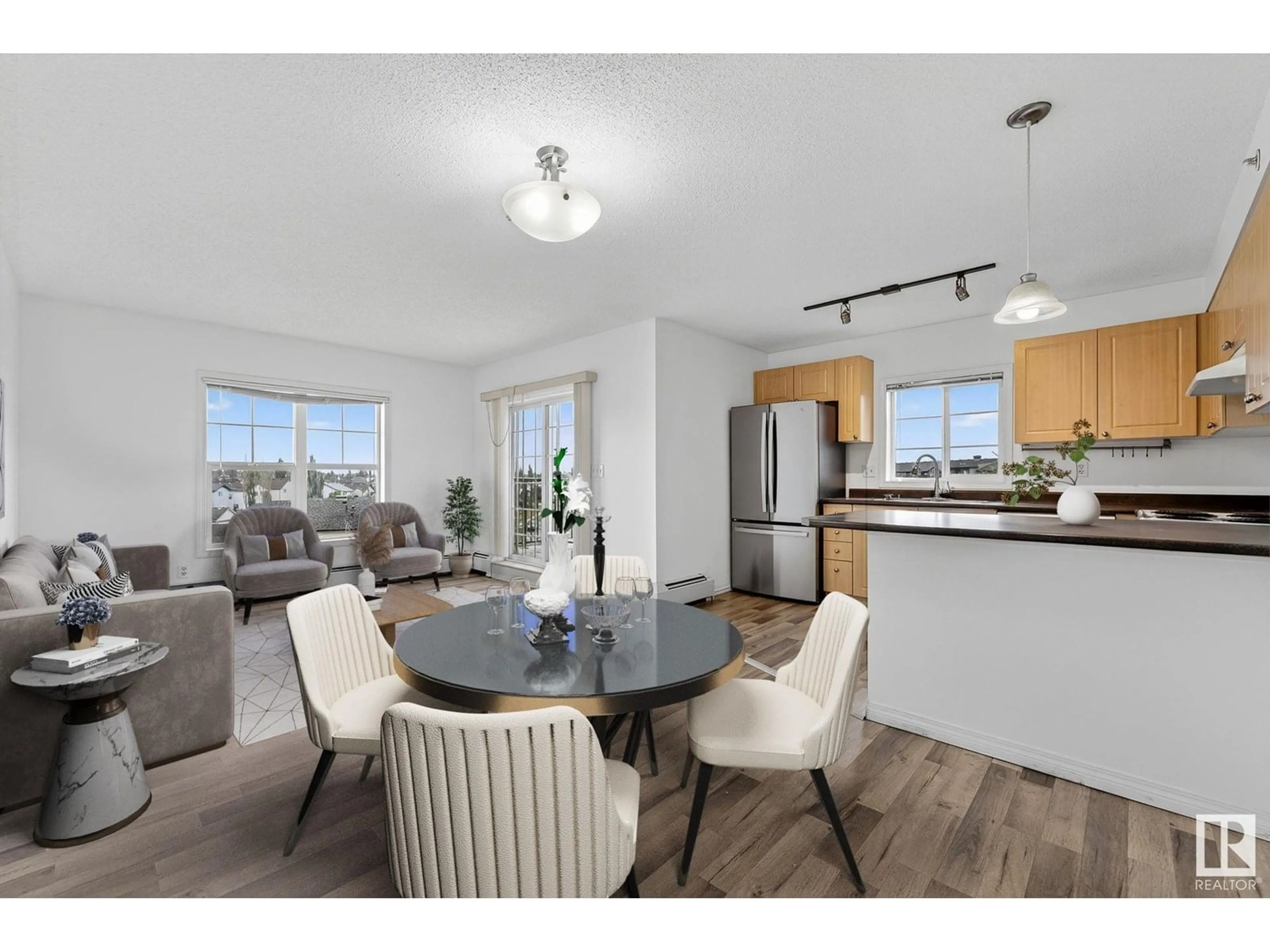 Open concept kitchen, wood/laminate floor for 622 - 418 MCALLISTER LO, Edmonton Alberta T6W1N2