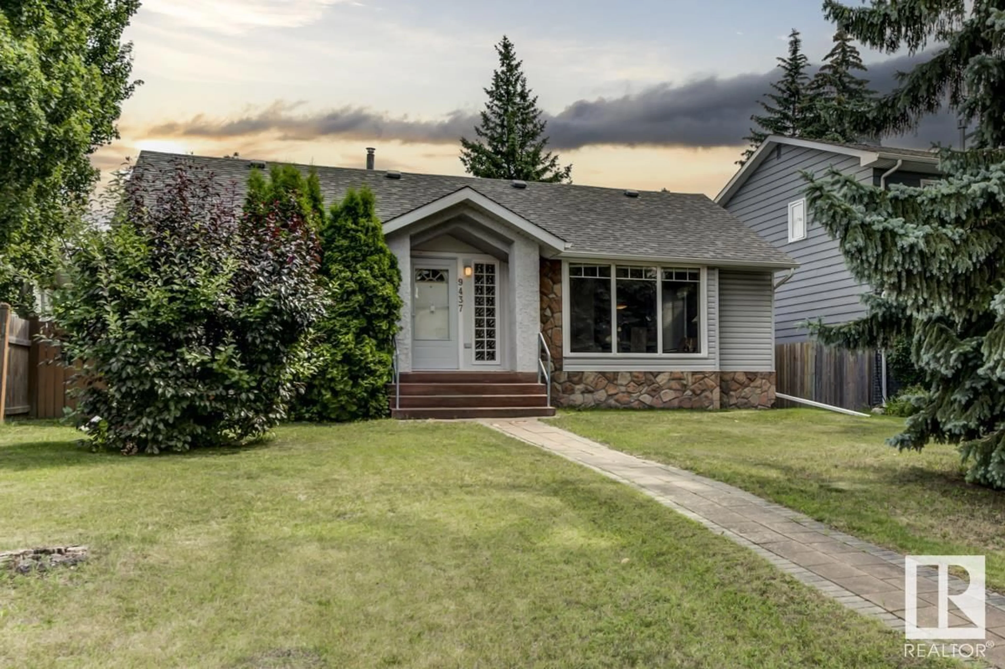 Home with vinyl exterior material, street for 9437 144 ST, Edmonton Alberta T5R0R8