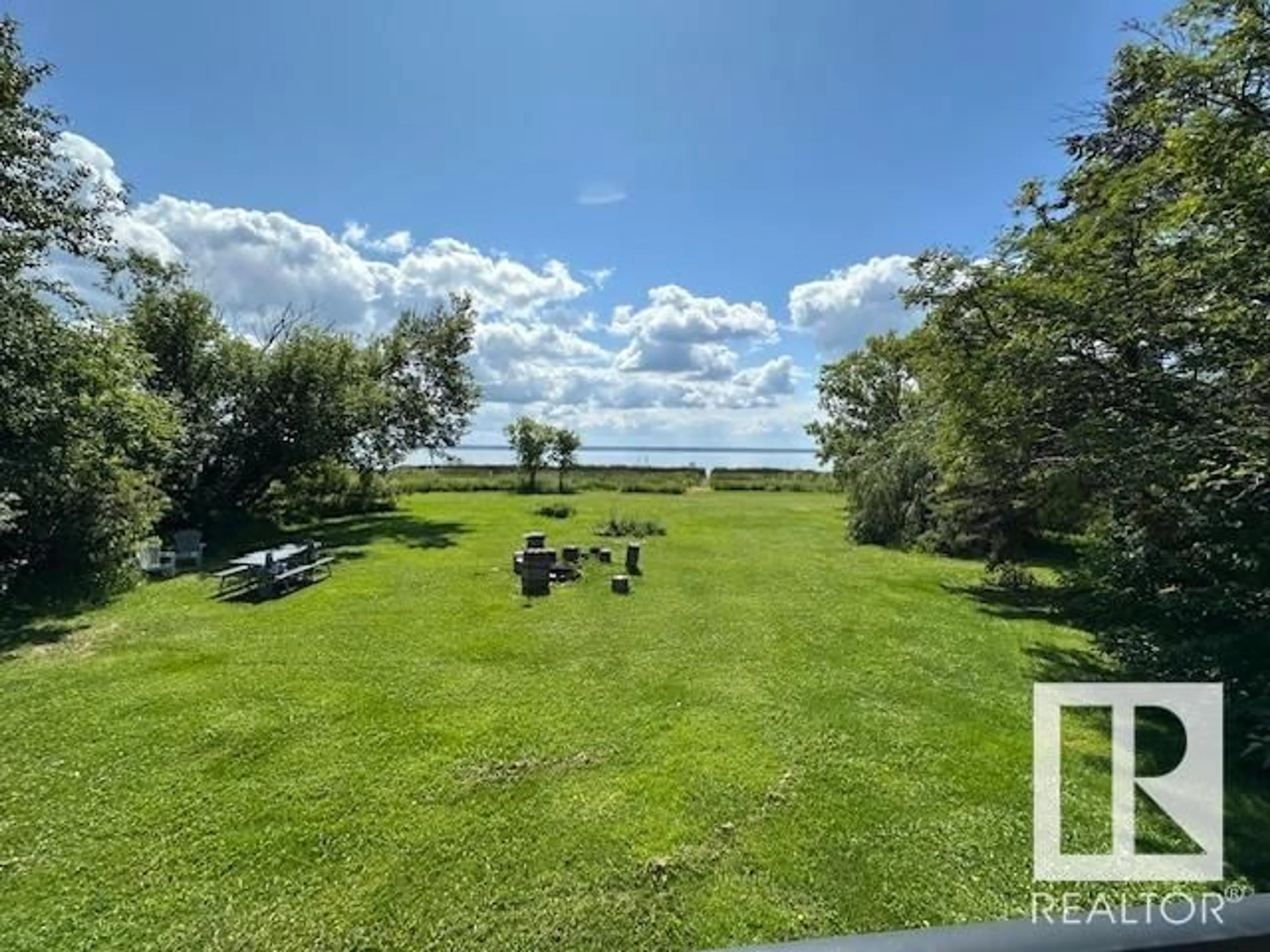 A pic from outside/outdoor area/front of a property/back of a property/a pic from drone, water/lake/river/ocean view for 609 55107 RGE ROAD 33, Rural Lac Ste. Anne County Alberta T0E1V0