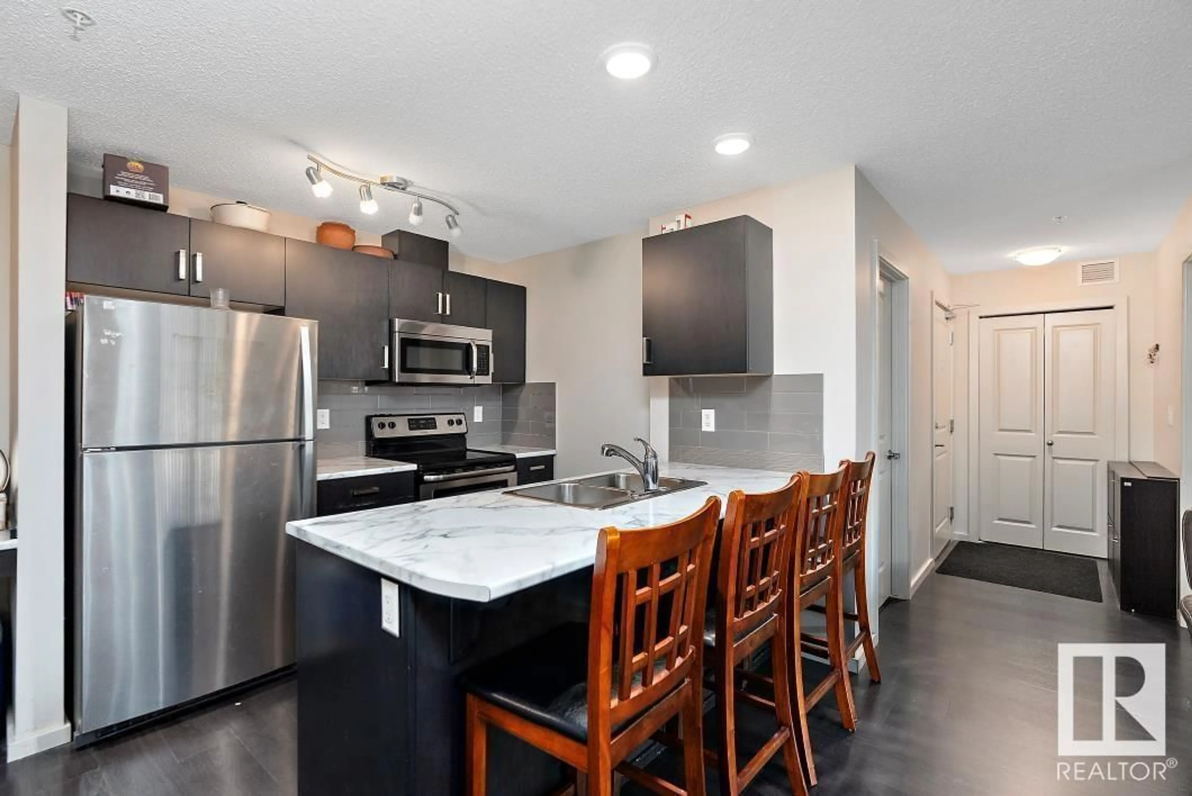 Open concept kitchen, ceramic/tile floor for 227 5515 7 AV SW, Edmonton Alberta T6X2A8