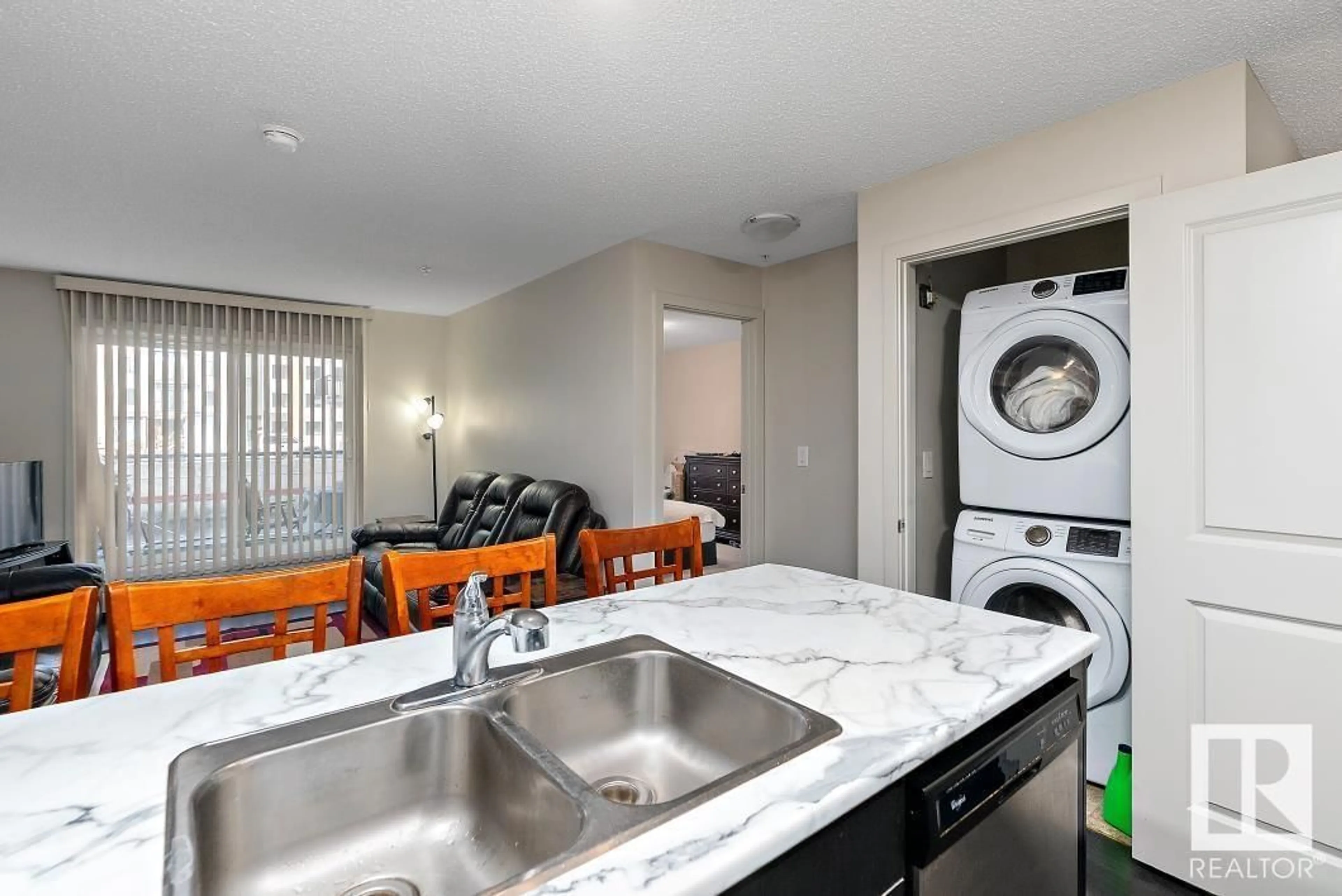 Kitchen with laundary machines, unknown for 227 5515 7 AV SW, Edmonton Alberta T6X2A8